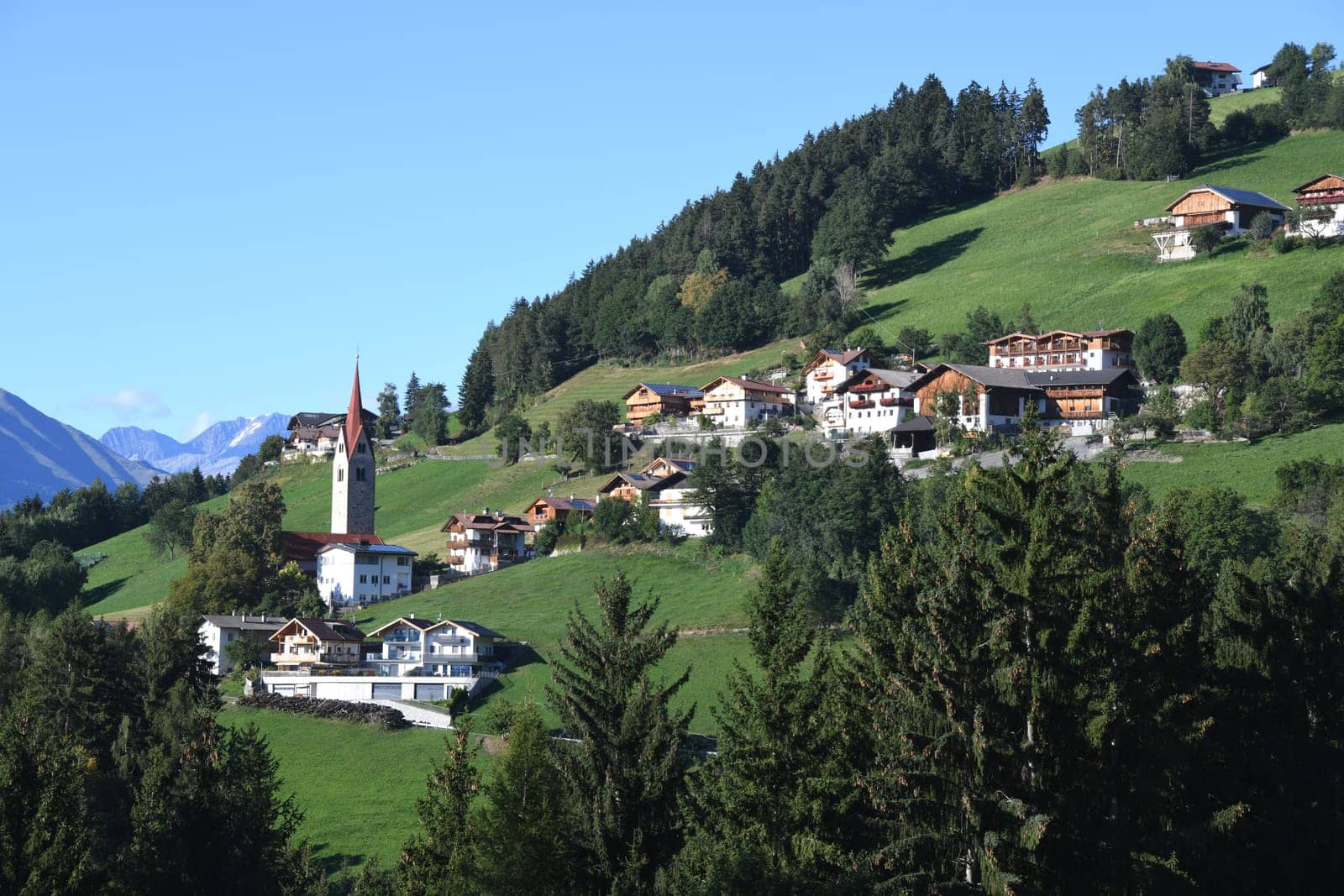 The mountain village of St. Leonhard near Brixen in the Province of Bozen in South Tyrol,Italy. St. Leonhard's Church is in the center of town. It was inaugurated in 1194,redesigned around 1430 and later baroque-styled.