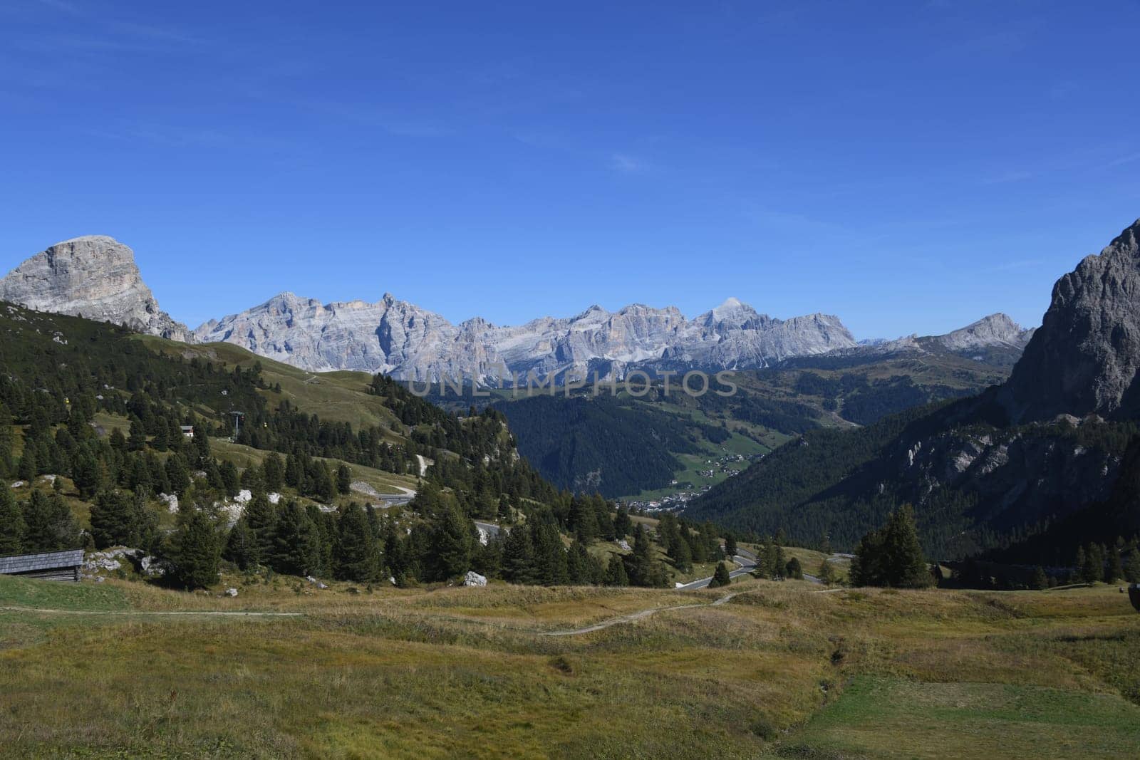 Panoramic view from the Gardena Pass to the Alta Badia Corvara valley and the Marmolada in Italian Marmolada and Ladin Marmoleda. It is the highest mountain in the Dolomites. Colfosgh with Mountain Sassongher