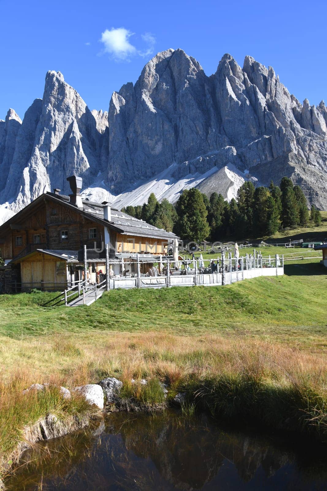 The Geisleralm in front of the beautiful mountain massif of the Geislerspitzen in the Dolomites,South Tyrol,Villnösstal,Trentino,Italen,Europe. The Alm can also be reached via the Adolf-Munkel-Weg.