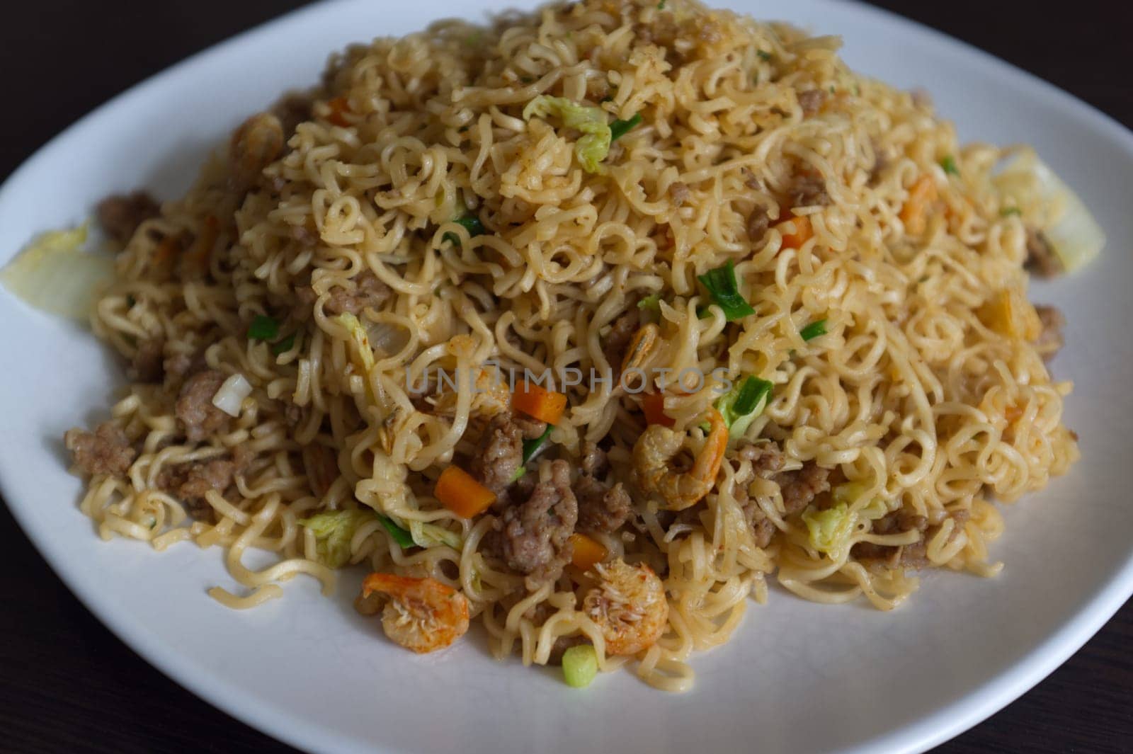 Fried instant noodle with carrot  and pork