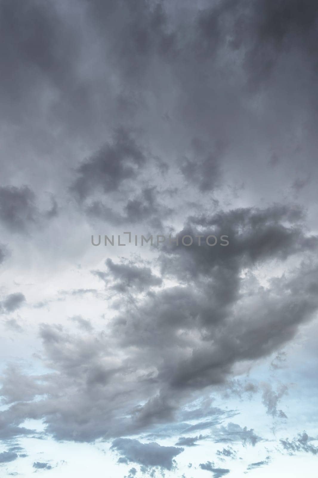 Black clouds hanging in the sky are a sign of overcastity. Dramatic sky.