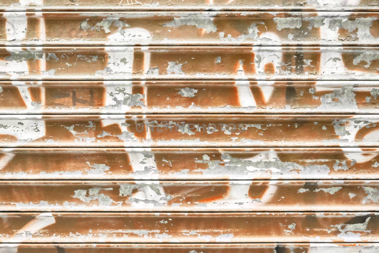 Brown metal shutter with peeling paint. Ideal use for background / wallpaper.