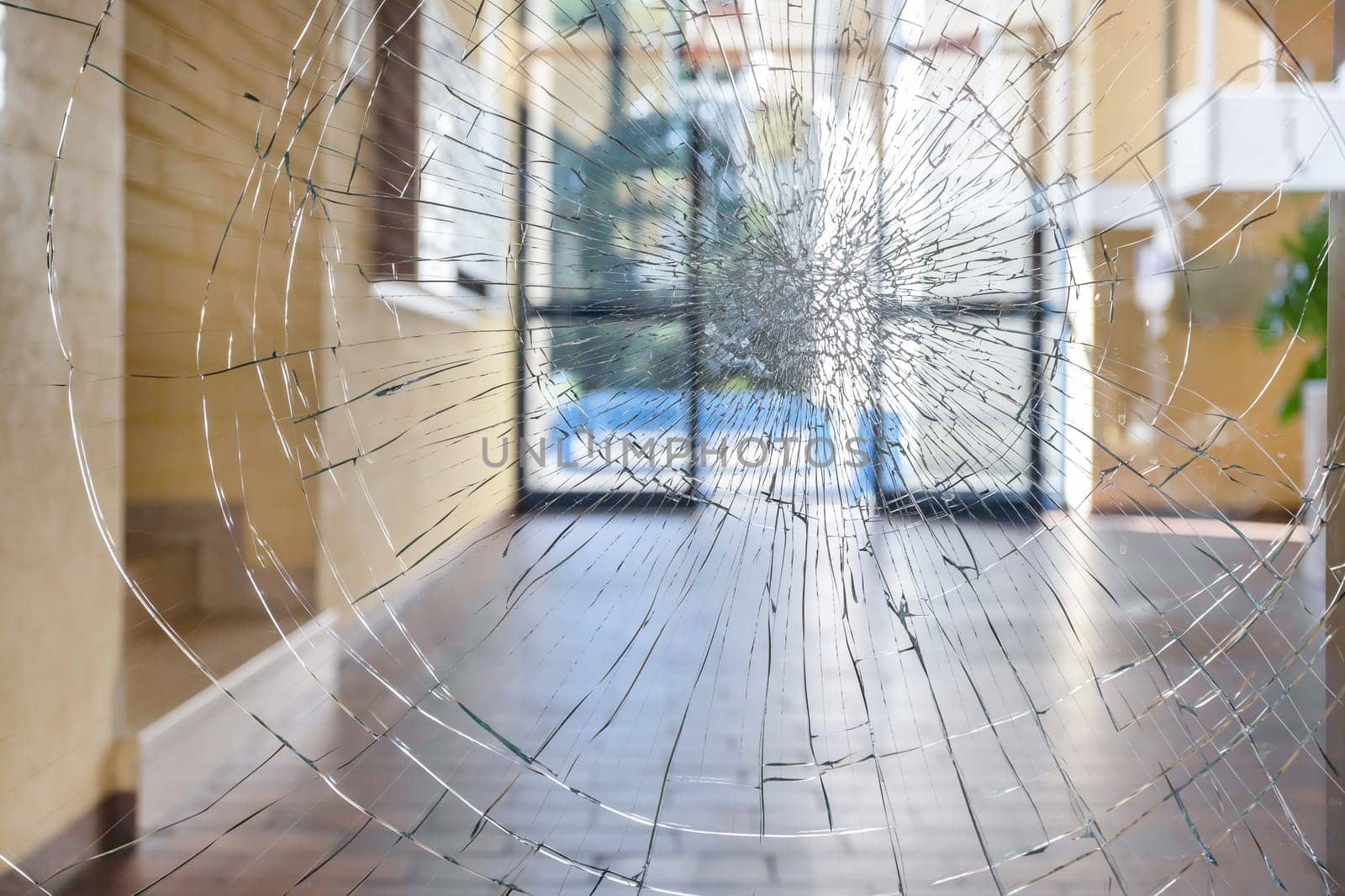 Shattered glass. Concept security theft damage vandalism in an apartment building.