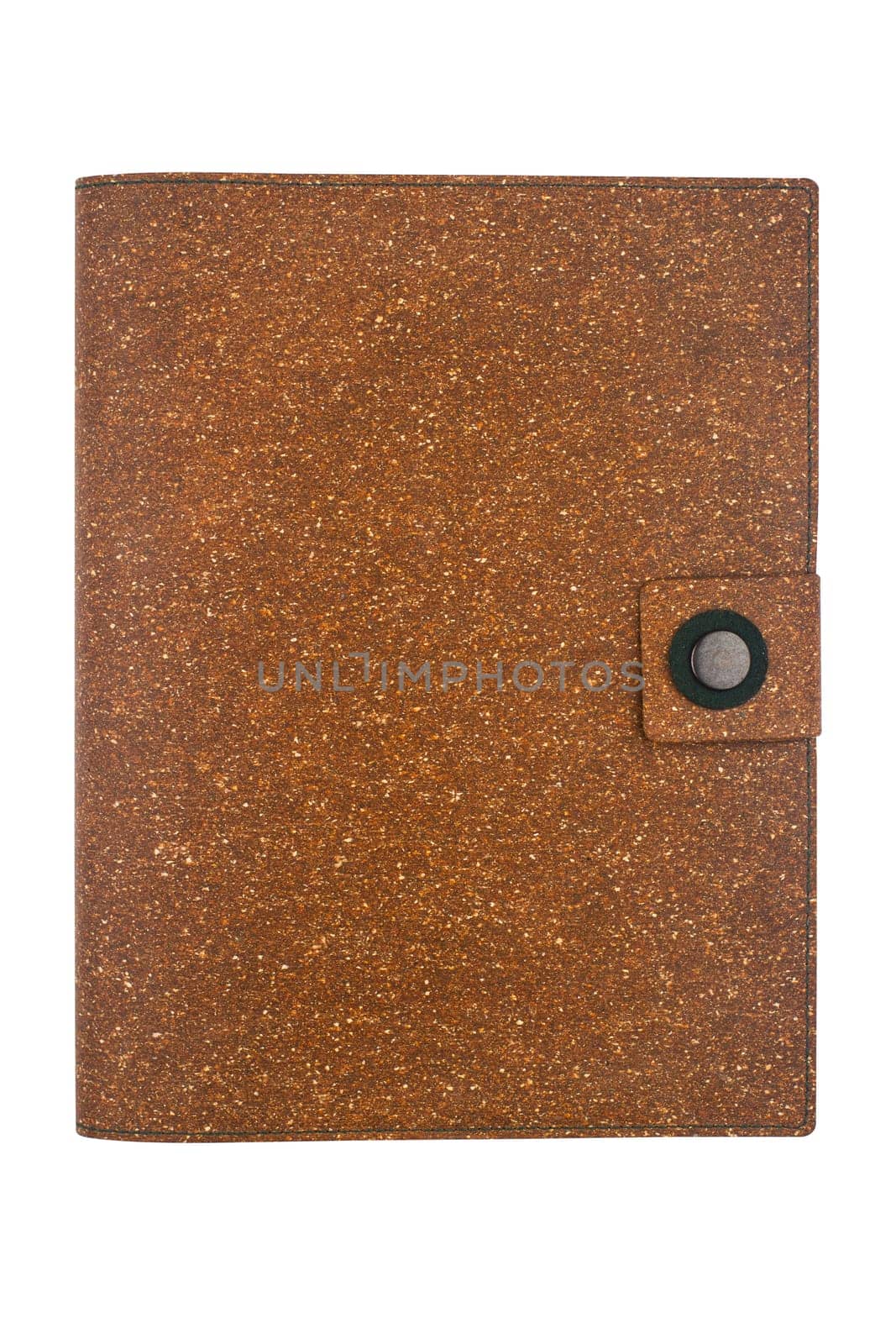 top view closeup of closed notebook with button enclosure and brown cork hardcover isolated on white background