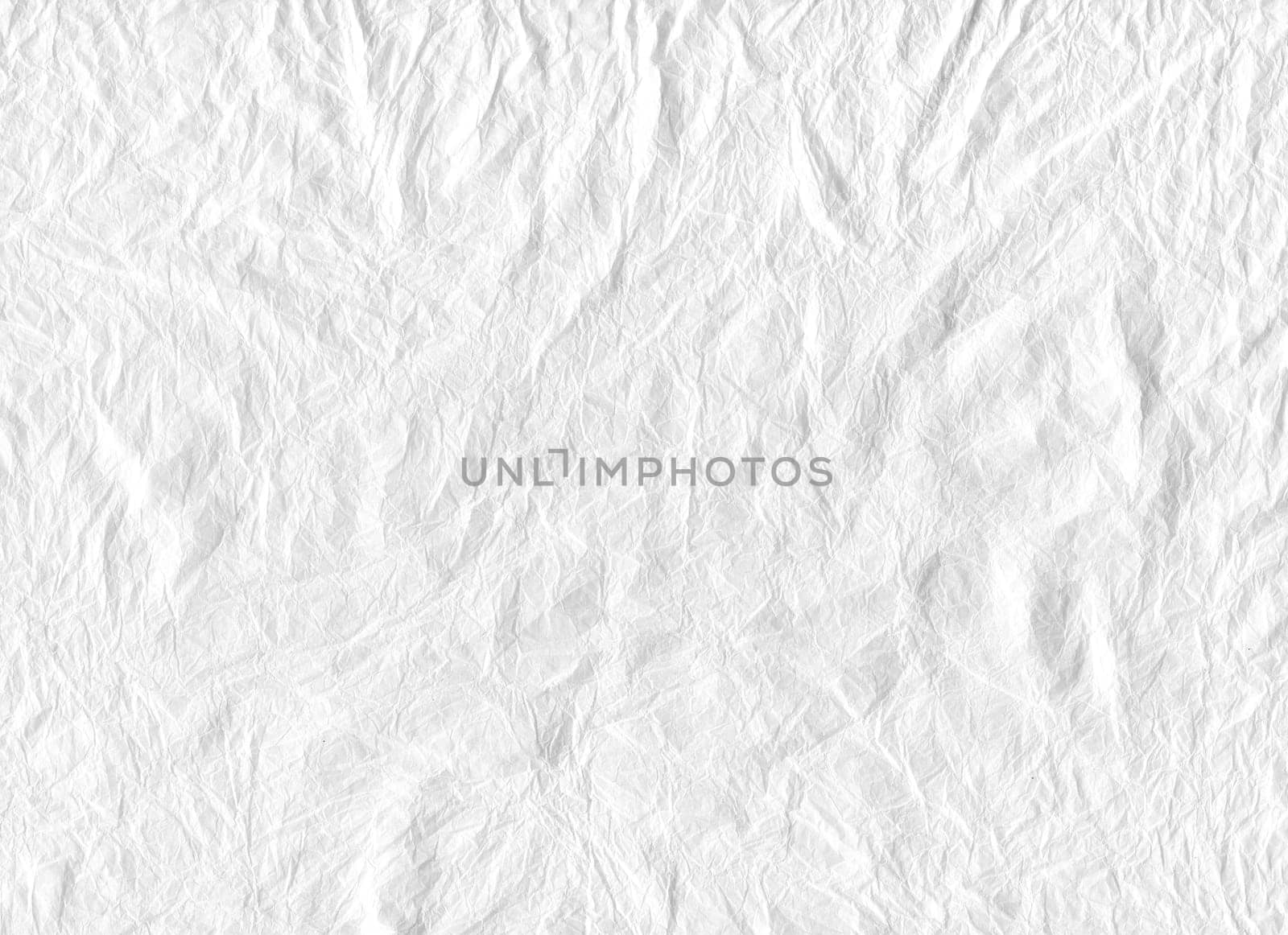 horizontal front view of crumpled white paper texture with heavy wrinkles background