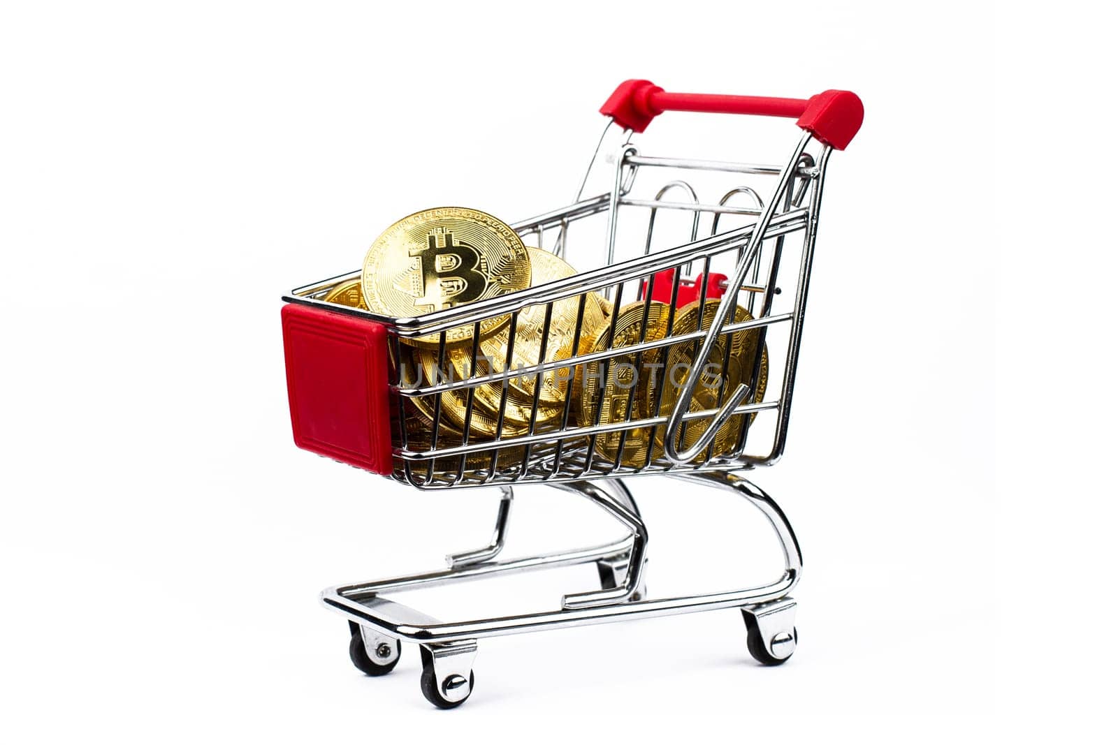 side view closeup cryptocurrency concept of market shopping cart full of bitcoin golden crypto coins isolated on white background