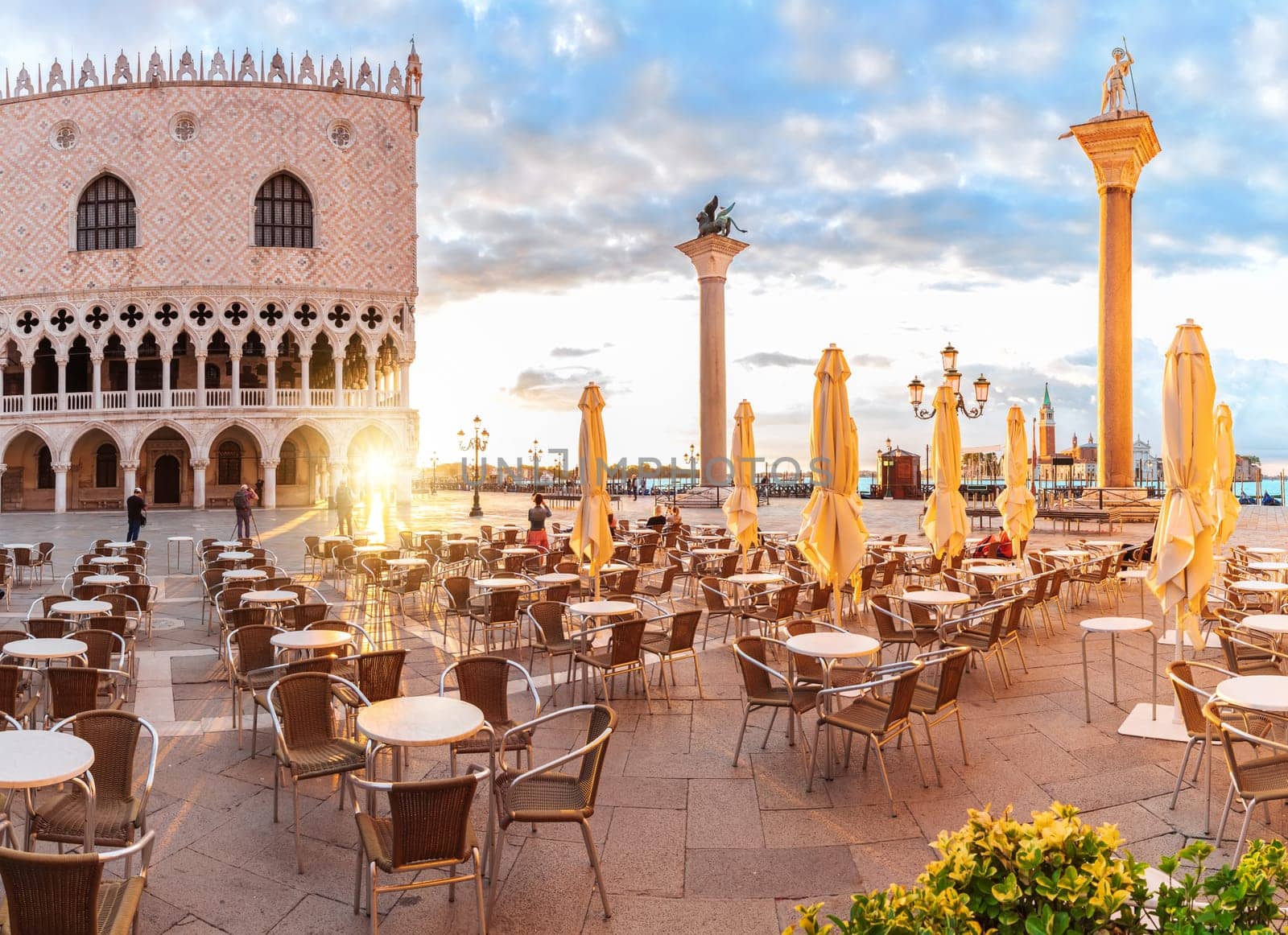 Traditional italian street cafe near the Doge's palace of Venice.
