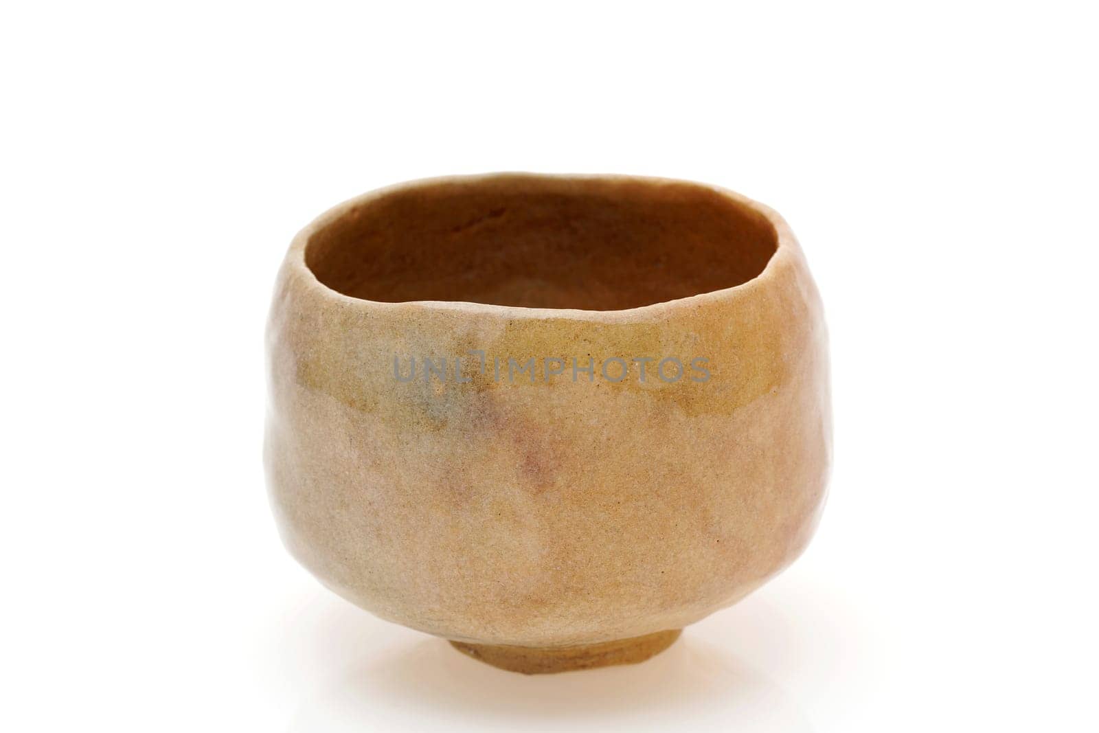 Single tea bowl used in Japanese matcha tea ceremony on white background