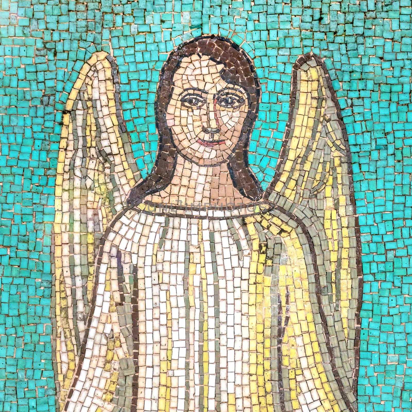 Mosaic depicting a smiling angel. Advent, Christmas, Easter concept.
