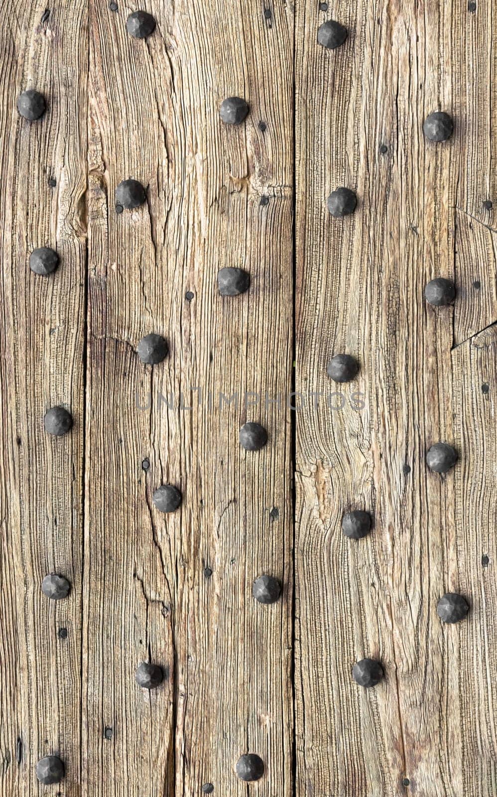 Wooden planks background. Old wooden planks with rusty bronze nails.