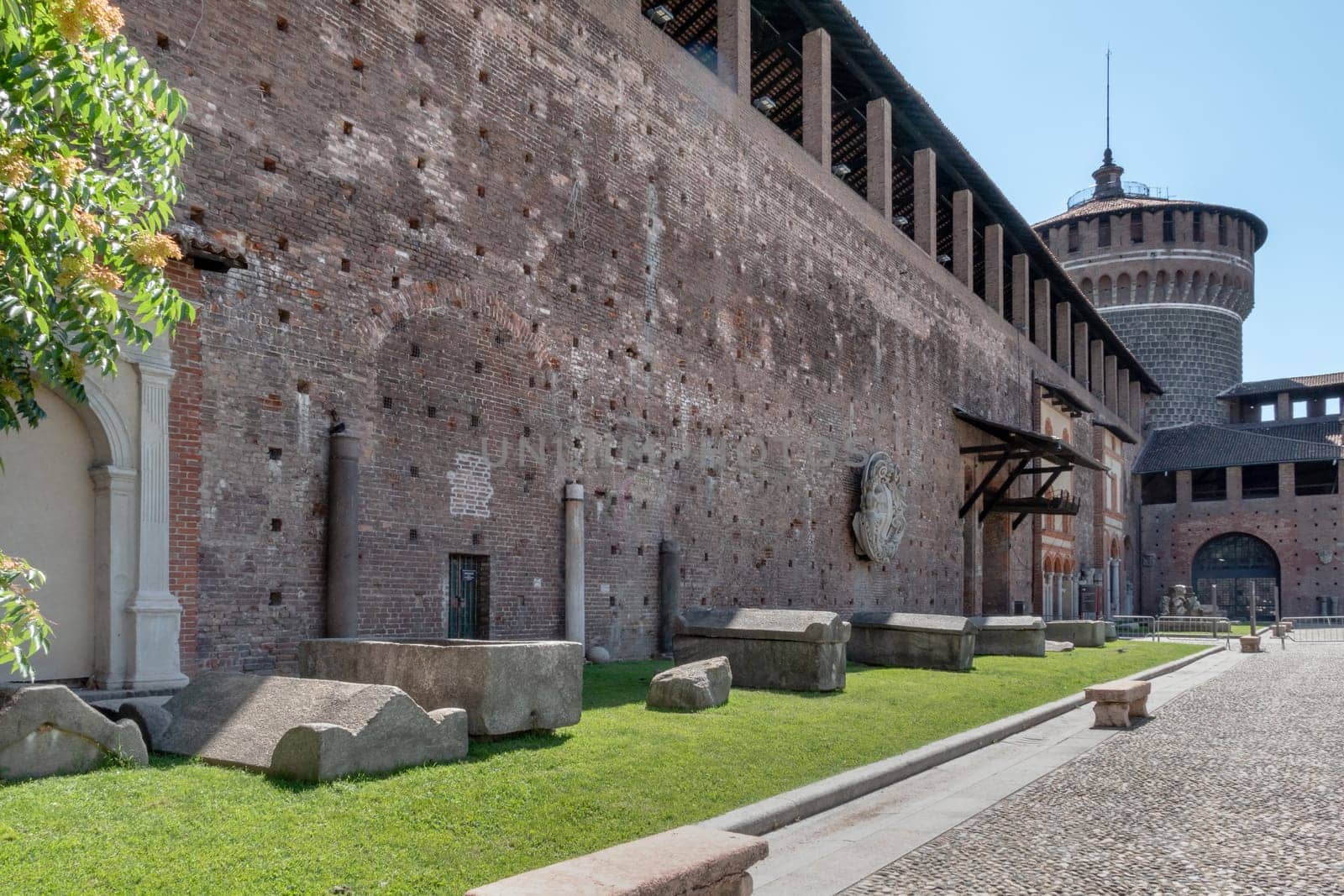 Inside the Sforza Castle (Castello Sforzesco) in Milan (ITALY). One of the main travel attractions of Milan, this castle was built in 15th century by Duke of Milan Francesco Sforza. Milan, ITALY - June 22, 2020.