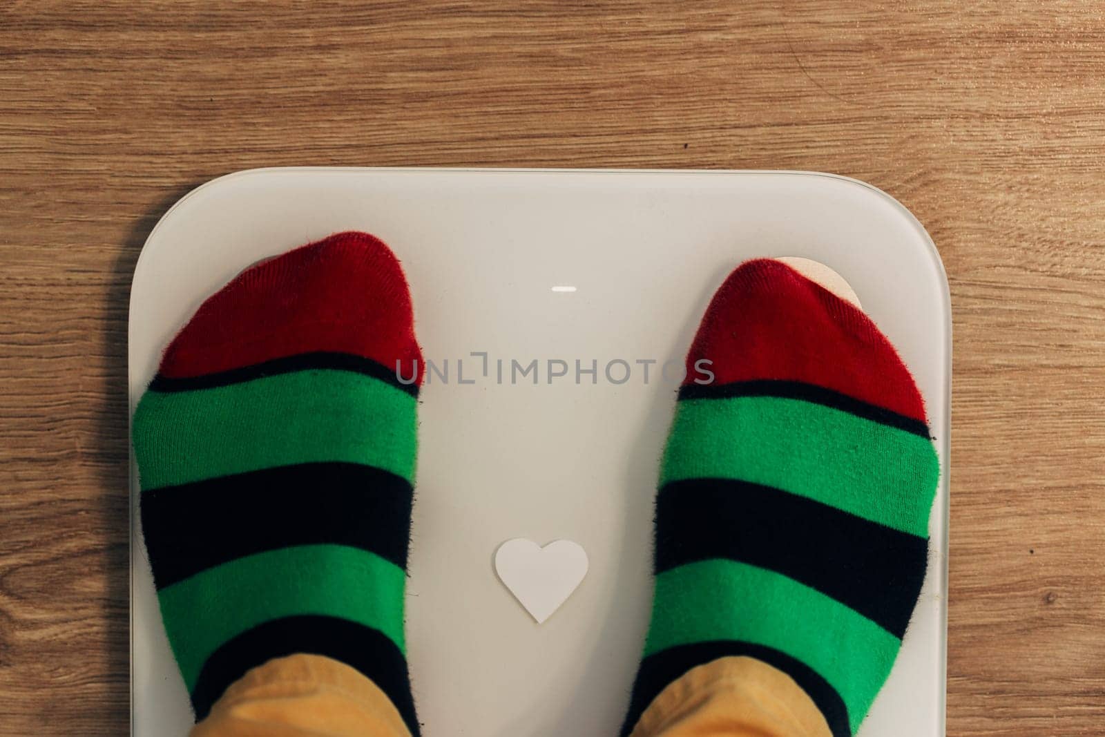 Smart Scales for Home. Girl Measures Weight During Diet.