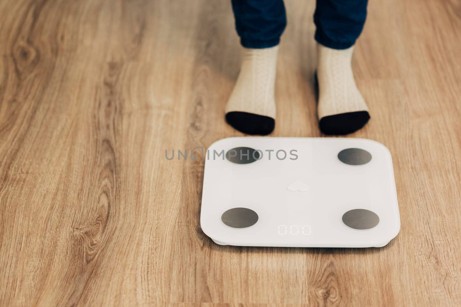 Modern Electronic Device. Girl Measures Weight on Smart Scales.