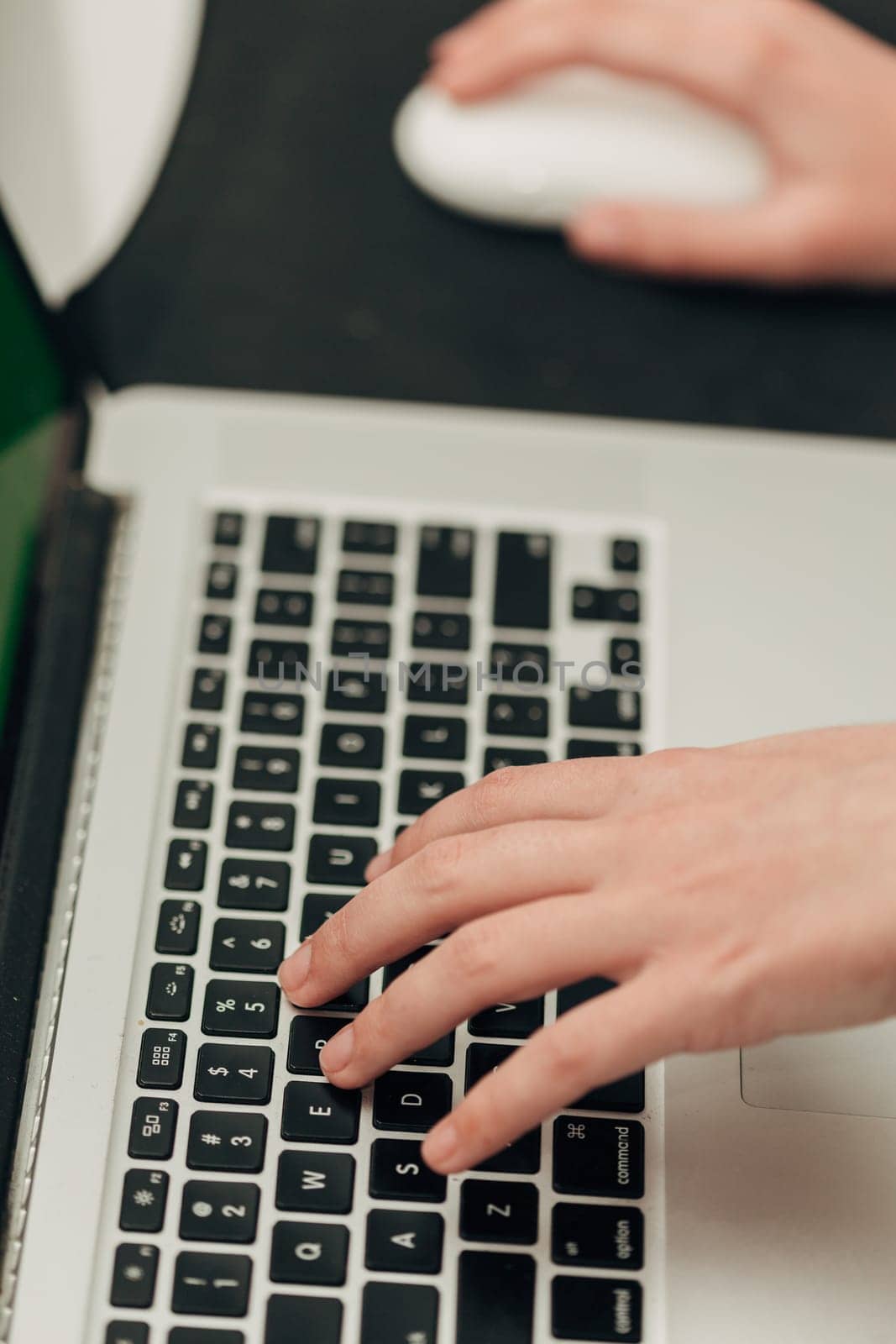 Close-Up Shot of Human Hands Placed Over Laptop.