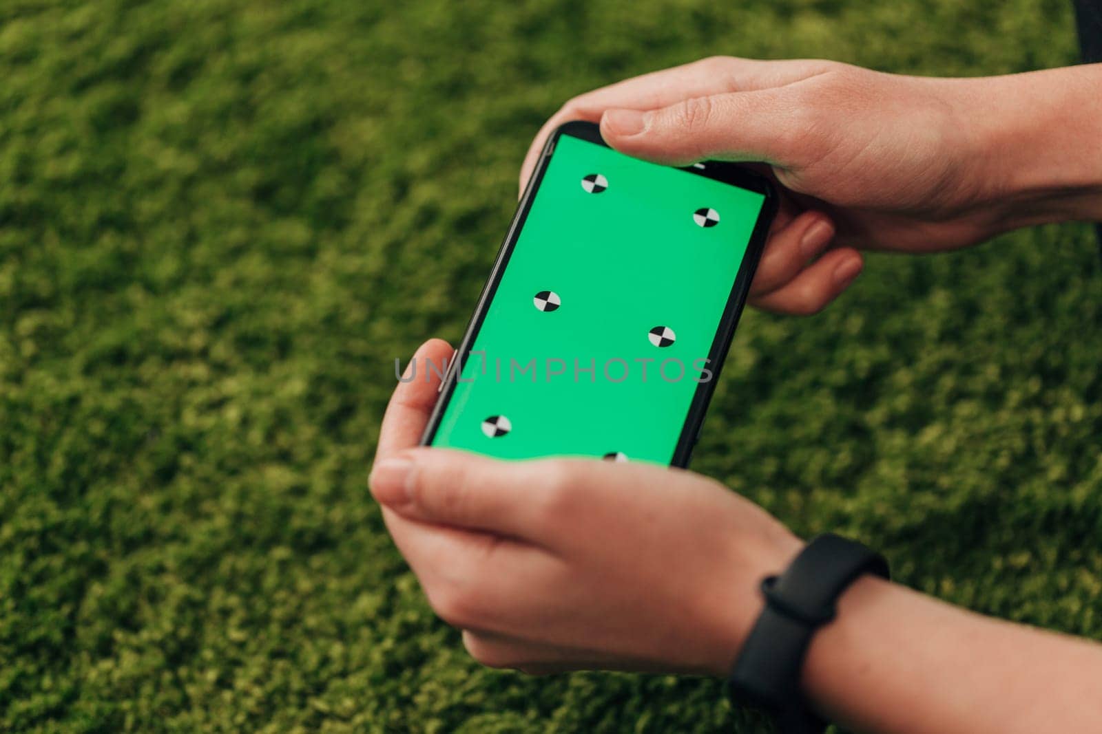 Girl Holds An New Smart Phone In Her Hand. Chroma Key Green.