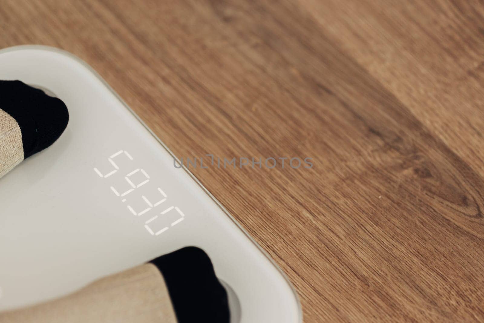 Modern Electronic Device. Girl Measures Weight on Smart Scales.