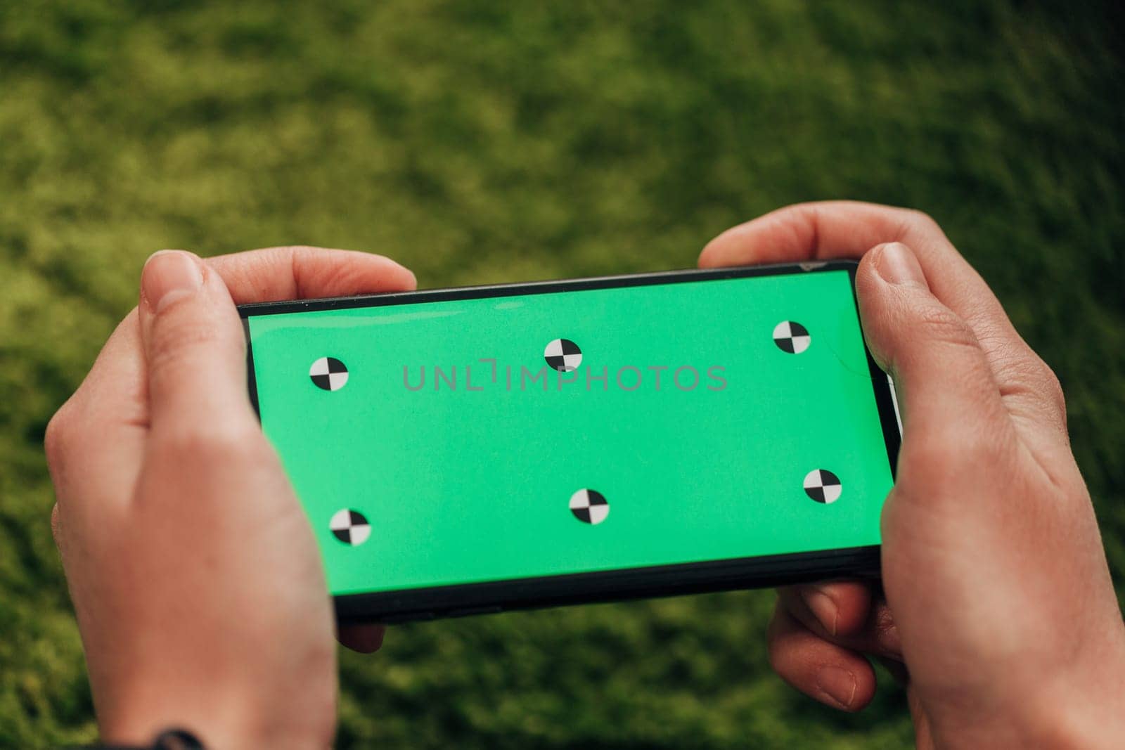 Girl Holds An New Smart Phone In Her Hand. Chroma Key Green.