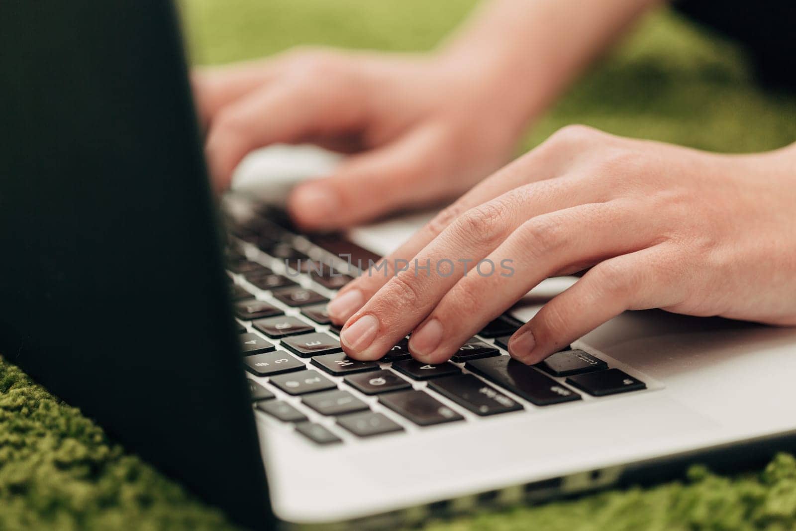 Close-Up Shot of Human Hands Placed Over Laptop.