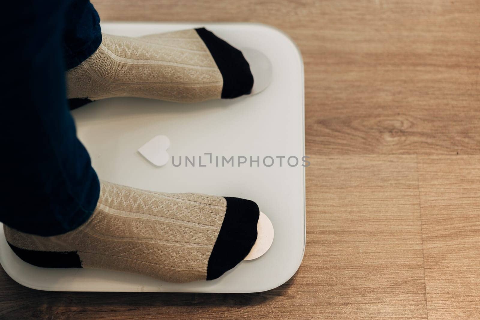 Modern Electronic Device. Girl Measures Weight on Smart Scales.