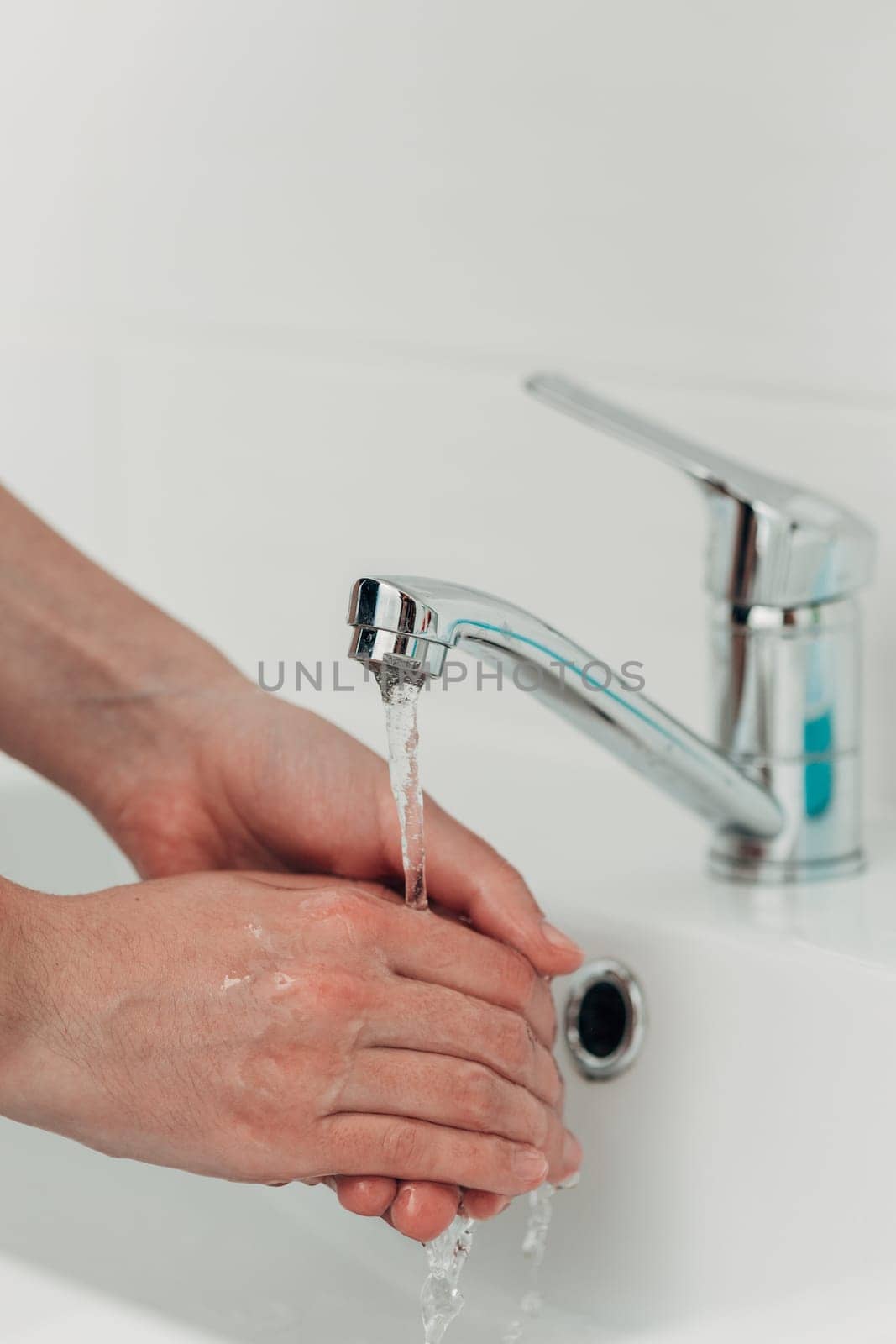 The Girl Washes Her Hands to Avoid Infection With the Virus COVID-19.