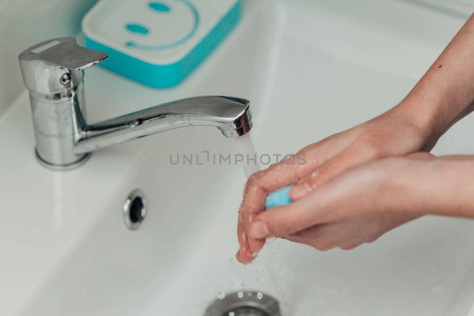 The Girl Washes Her Hands to Avoid Infection With the Virus COVID-19.