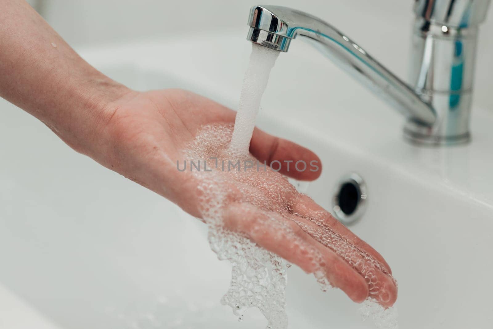 The Girl Washes Her Hands to Avoid Infection With the Virus COVID-19.