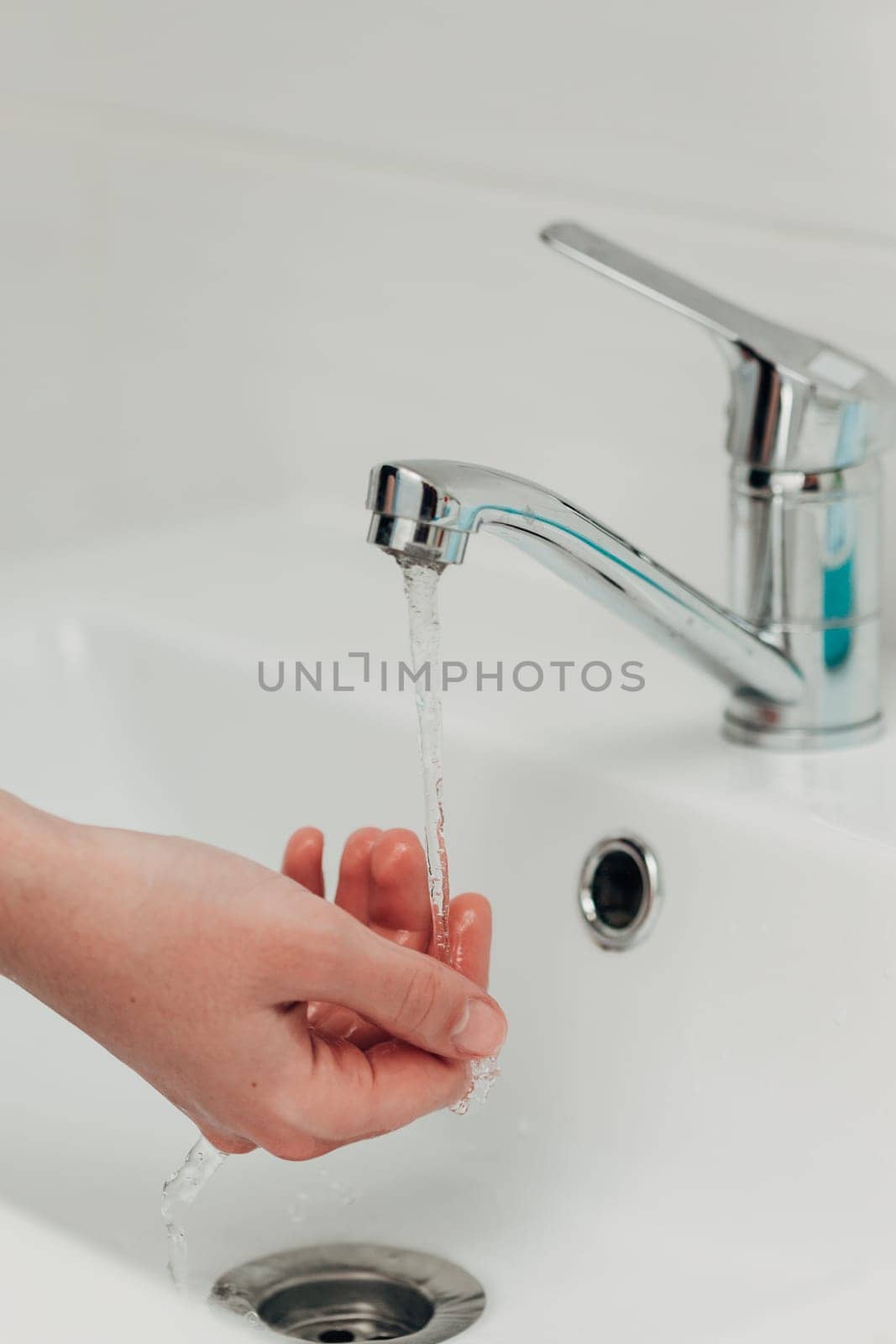 The Girl Washes Her Hands to Avoid Infection With the Virus COVID-19.