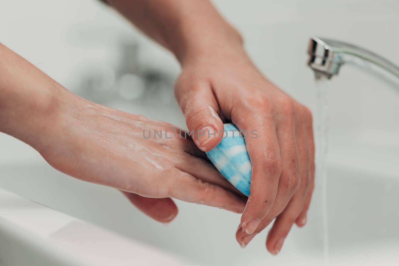 The Girl Washes Her Hands to Avoid Infection With the Virus COVID-19.