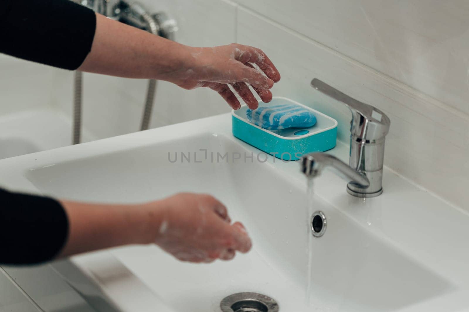 The Girl Washes Her Hands to Avoid Infection With the Virus COVID-19.