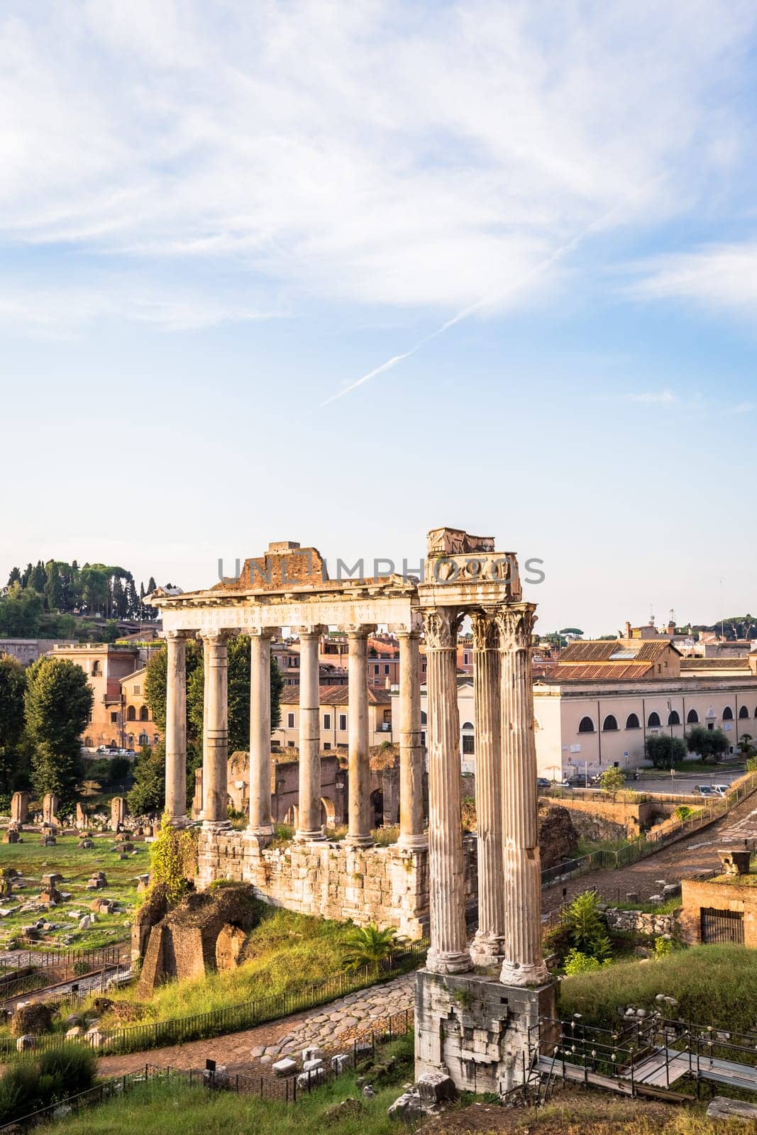 ROME, ITALY - CIRCA AUGUST 2020: sunrise light with blue sky on Roman ancient architecture.