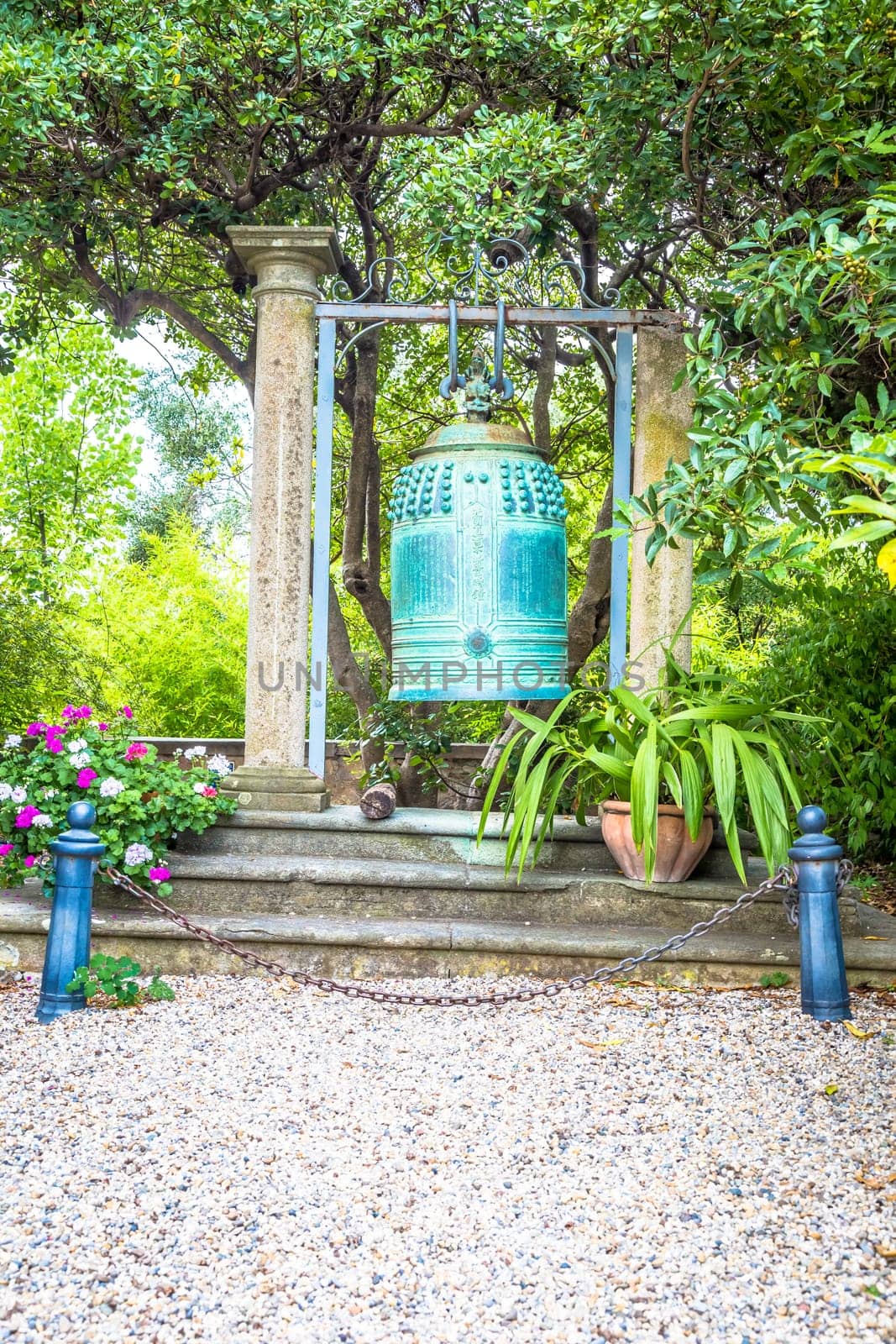VENTIMIGLIA, ITALY - CIRCA AUGUST 2020: old Japanese bell located in Hambury Gardens and finely crafted in bronze. It seems to come from a Buddhist shrine destroyed by a fire in central Japan.