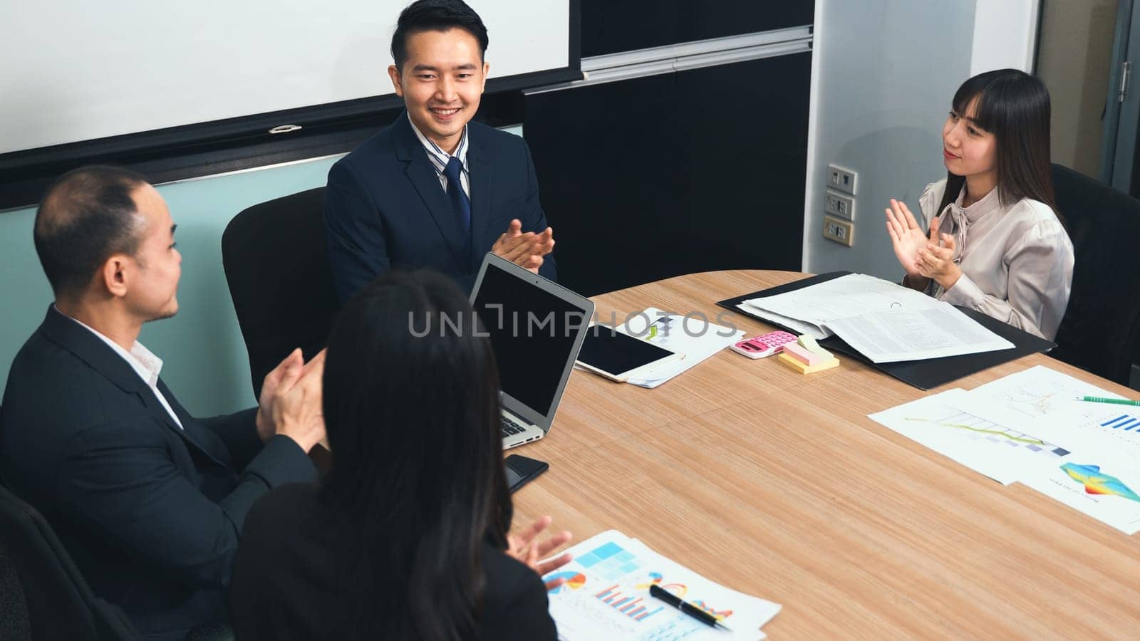 Business people team confident working and communicating together and were clapping applauding their hands success happy and smiling in meeting room at office, Agreement business concept