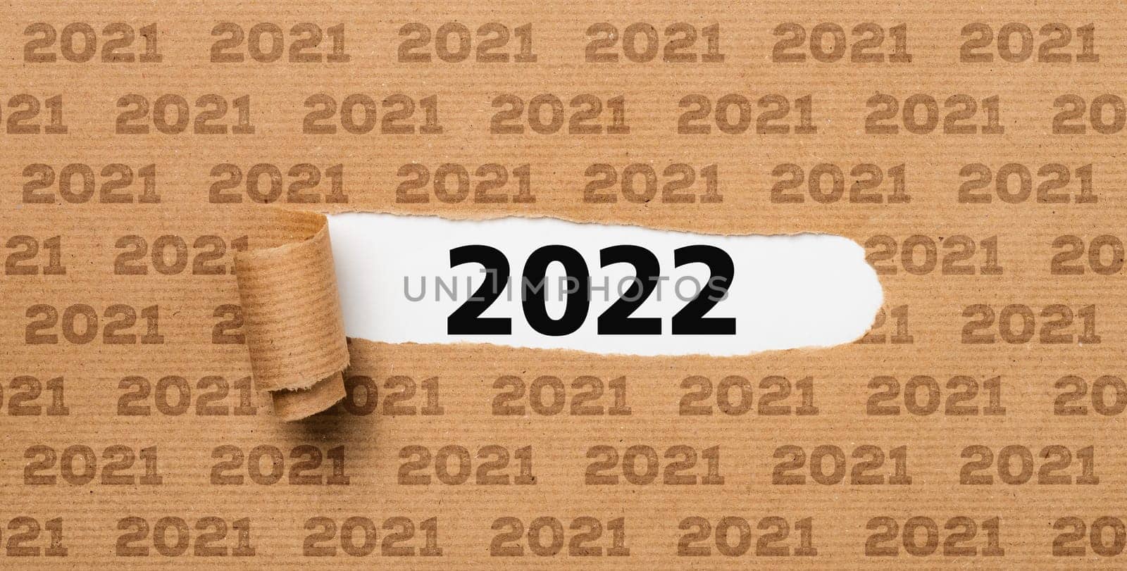 Torn paper revealing the number 2022