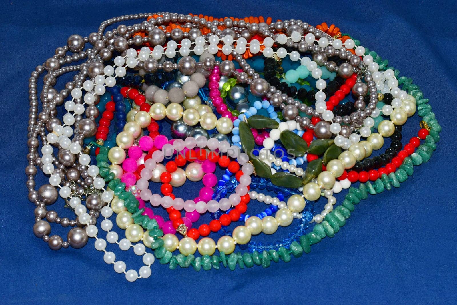 colorful womens beads on a blue background