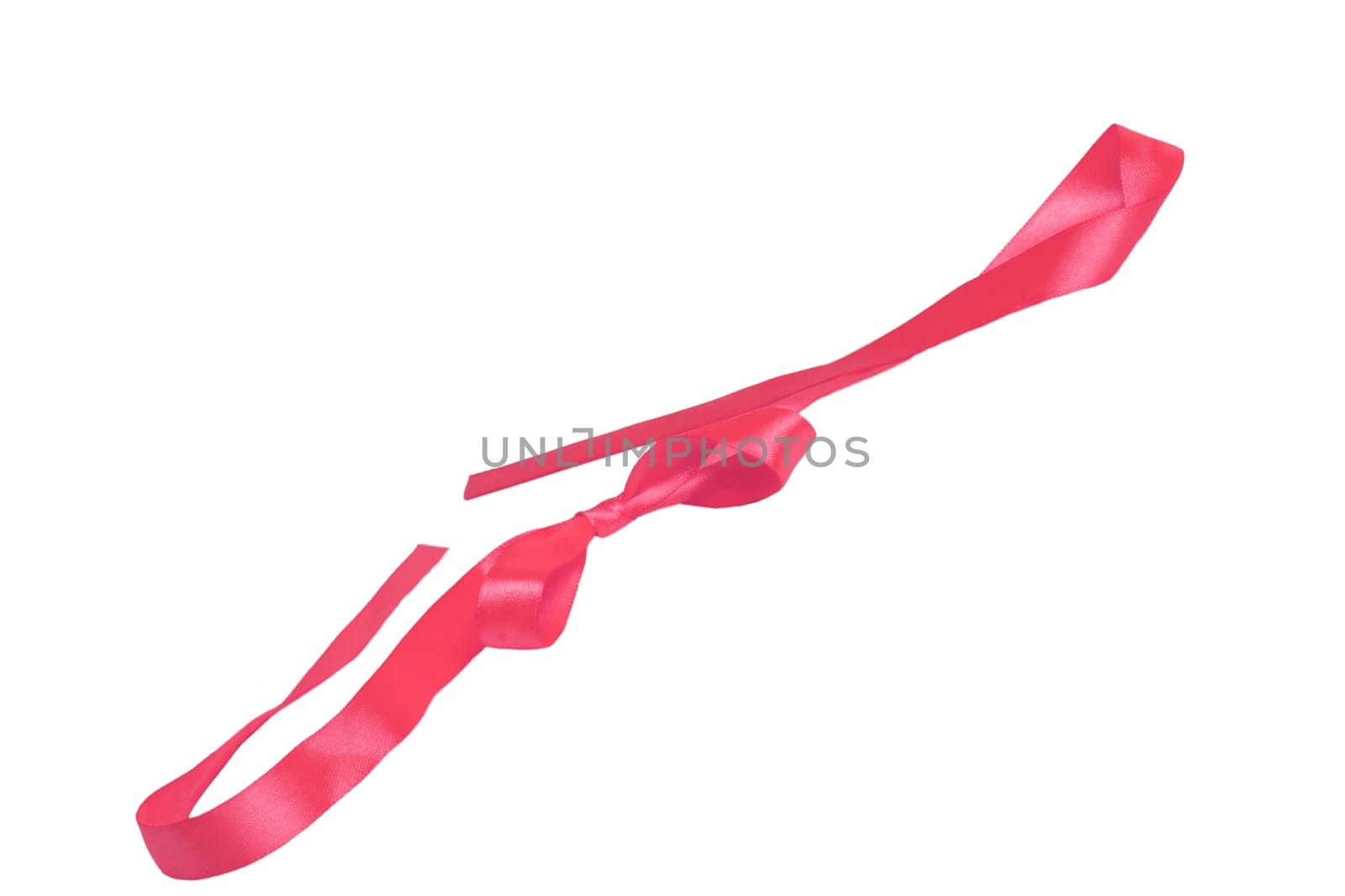 Gift bows. Closeup of a decorative red ribbon bow made of silk for gift box isolated on a white background. Decorations background. Macro photograph.