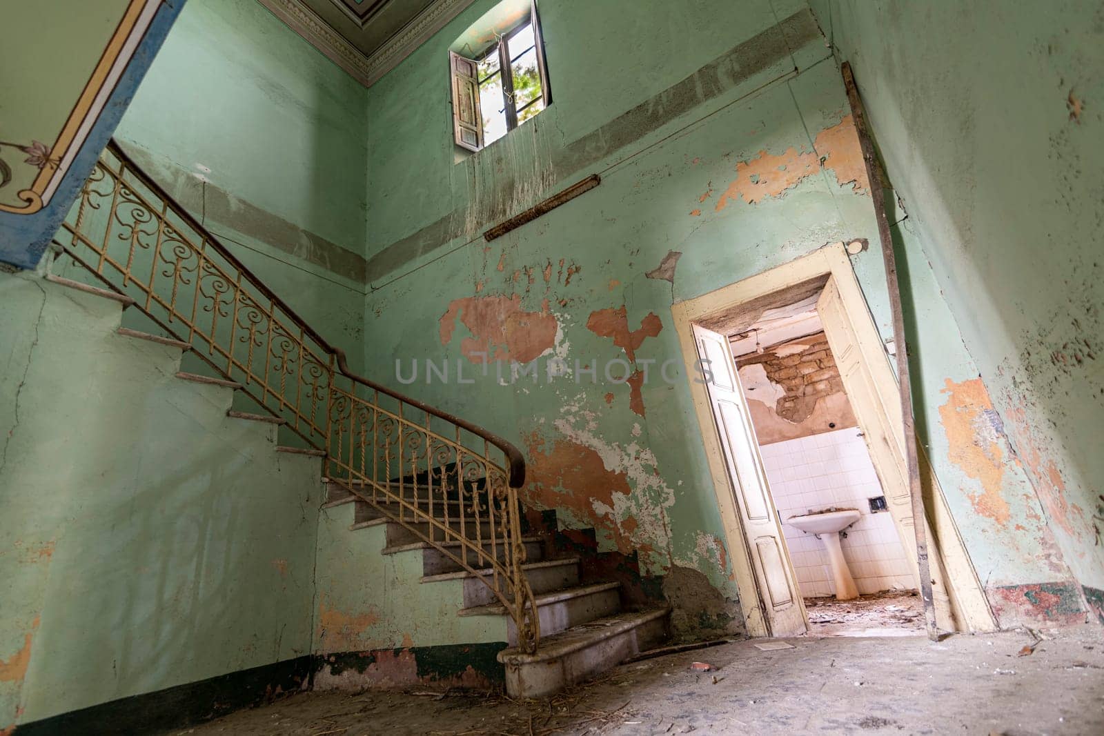 Interior of a decaying abandoned house. Art nouveau colors. Window openings. Mystery and darkness. long exposure times.