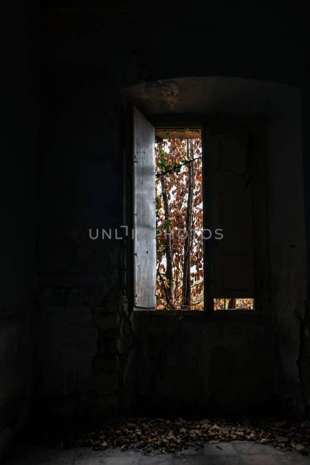 Interior of a decaying abandoned house. Art nouveau colors. Window openings. Mystery and darkness. long exposure times.