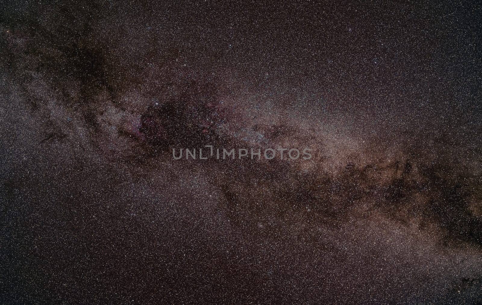 Night summer sky with milky way near swan constellation, North America nebula nebula faintly visible. Long exposure stacked photo.