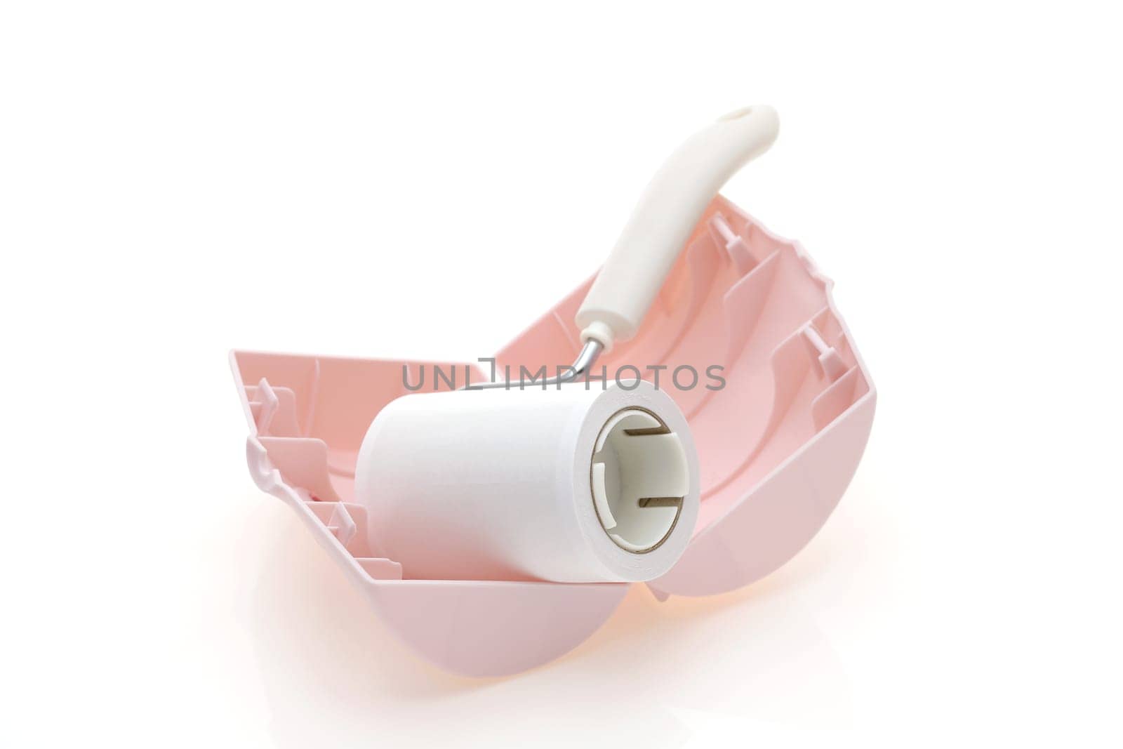 close up of sticky roller cleaning, housework and housekeeping concept