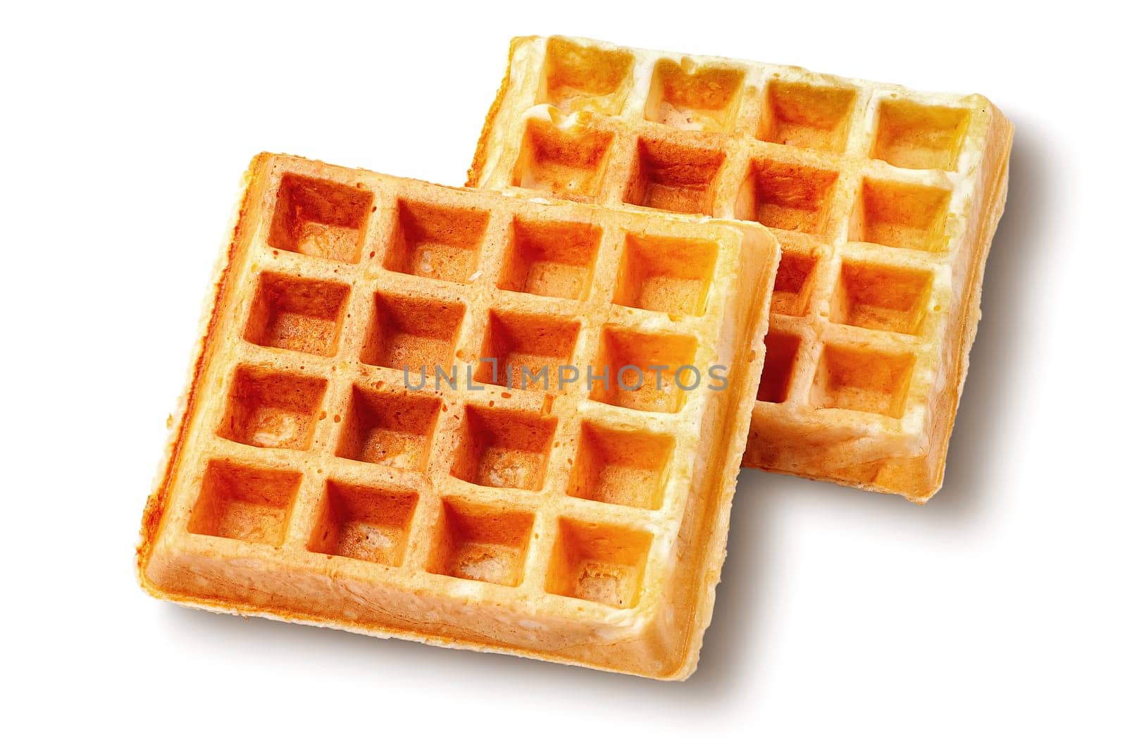 Two crispy fried french waffles isolated on white background