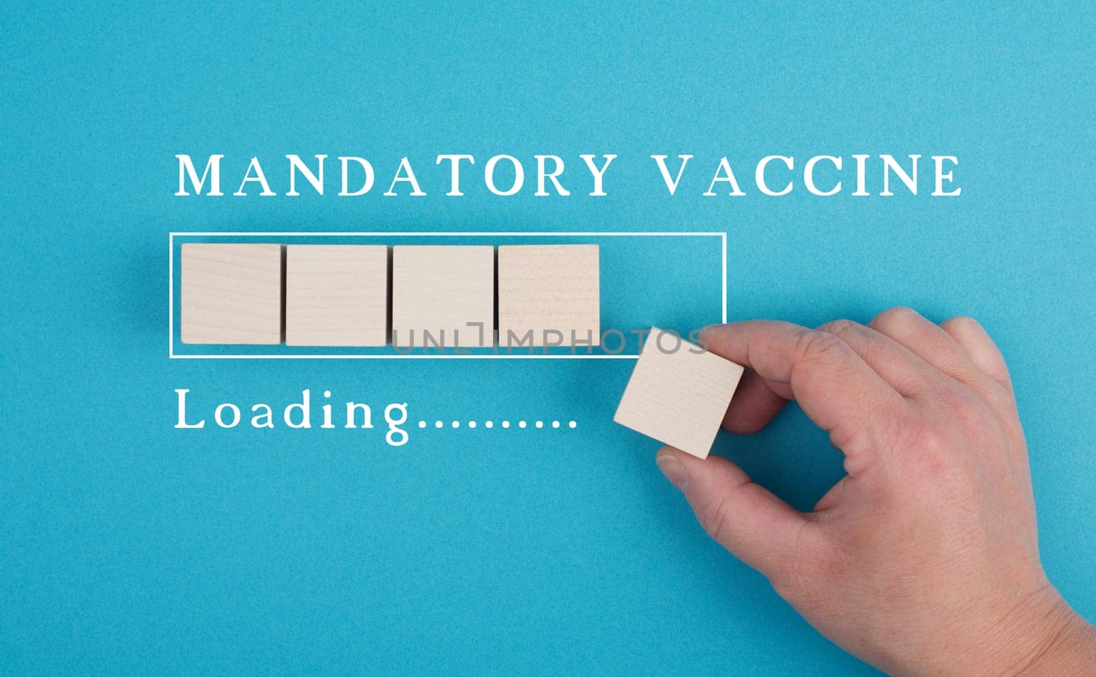 Mandatory vaccination is standing on a blue background, loading bar, hand puts last cube
