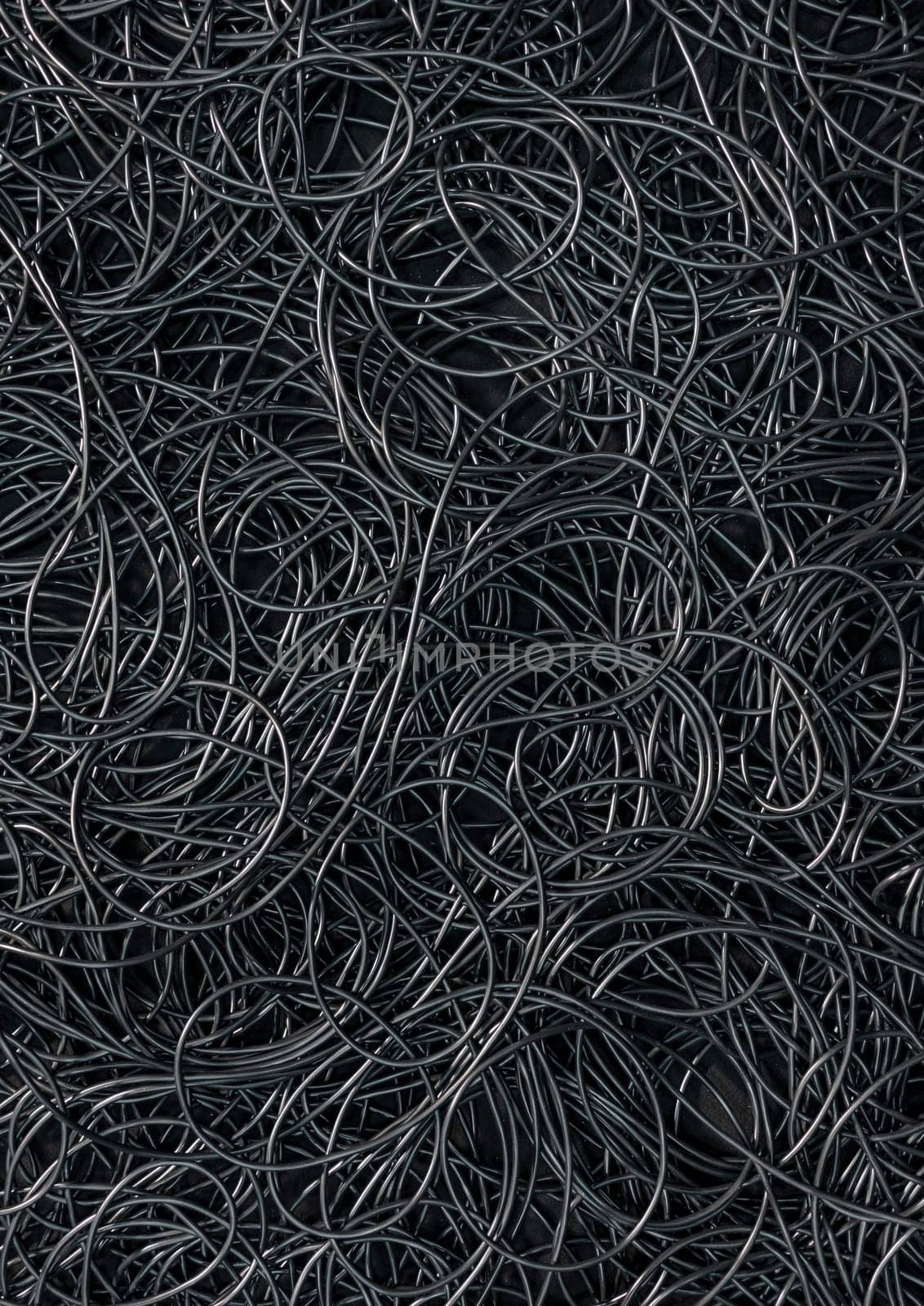 Background covered with a pile of electric cords filling the entire frame