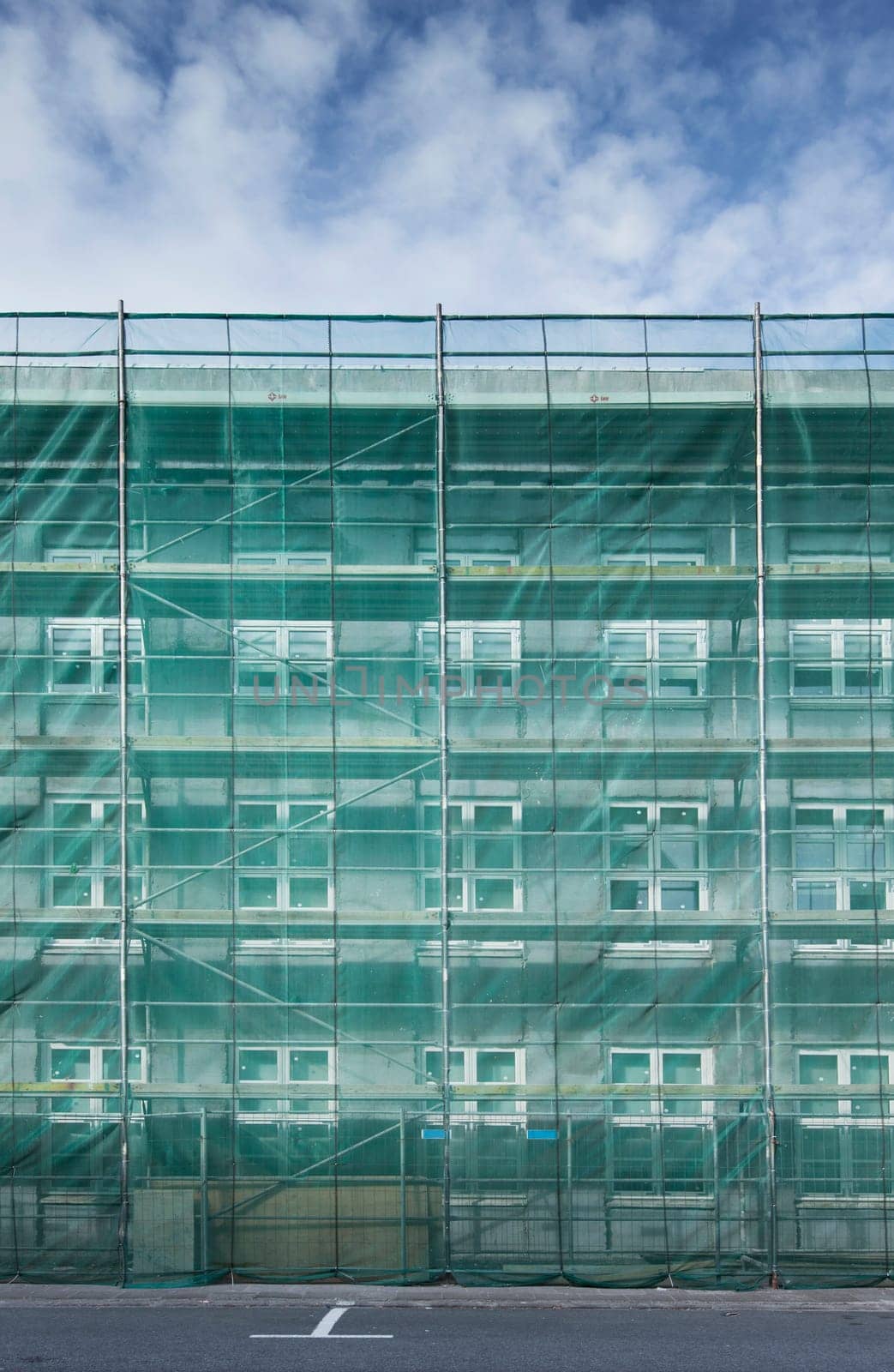 Scaffolding covering a house in construction