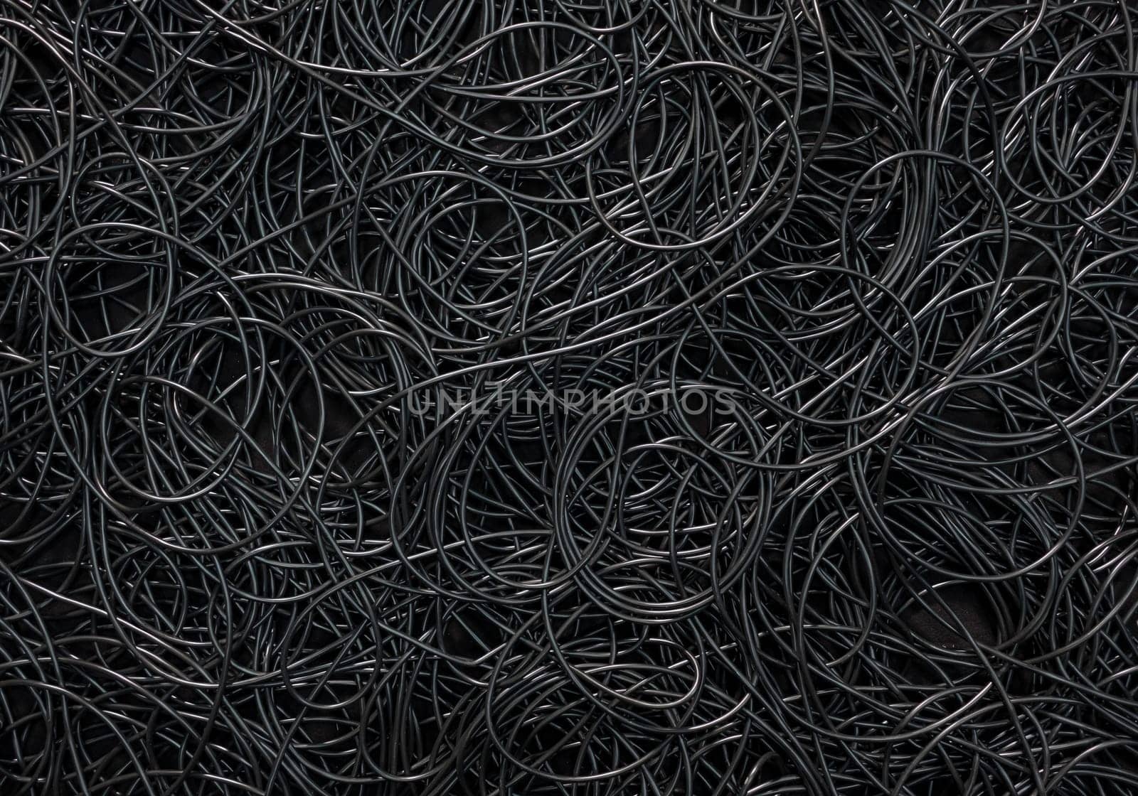 Background covered with a pile of electric cords filling the entire frame