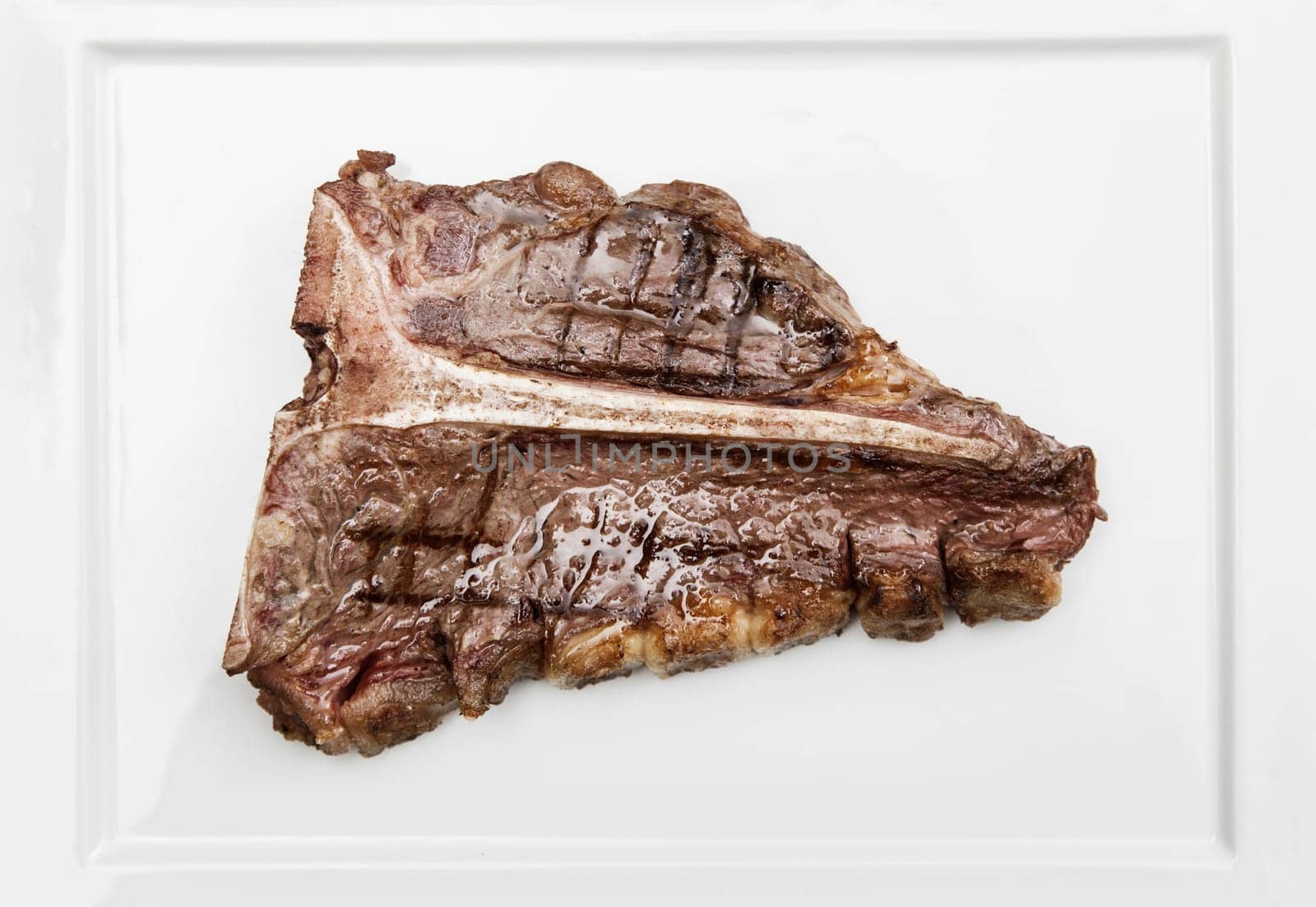 Delicious and juicy T-bone steak on a plate