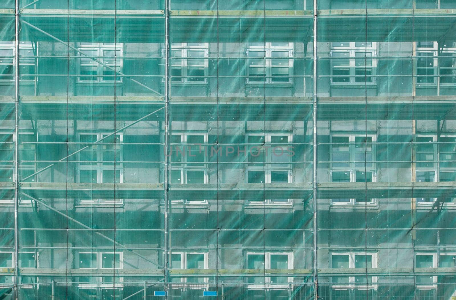 Scaffolding covering a house during building stage