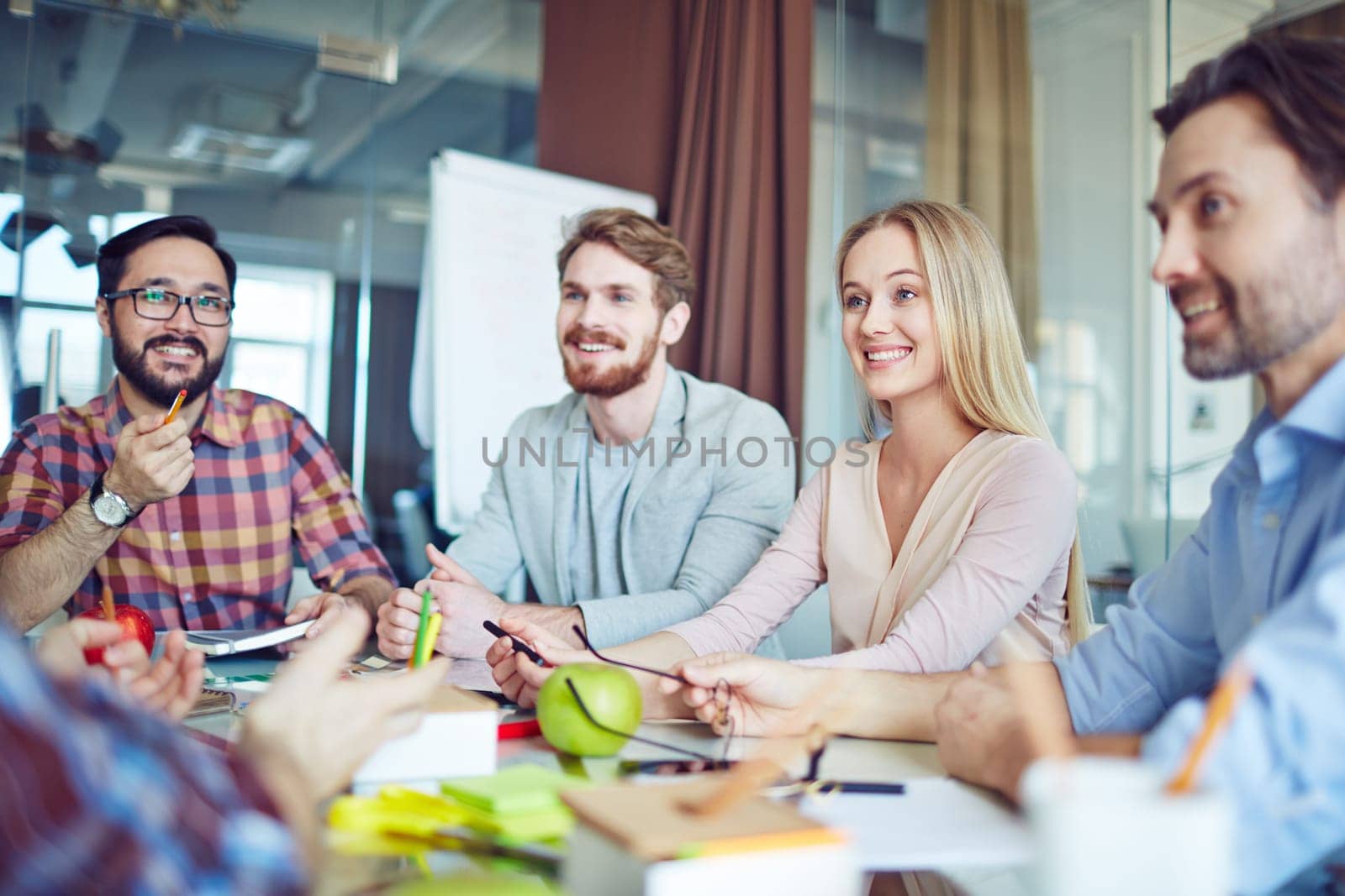 Business team sharing and discussing ideas in office