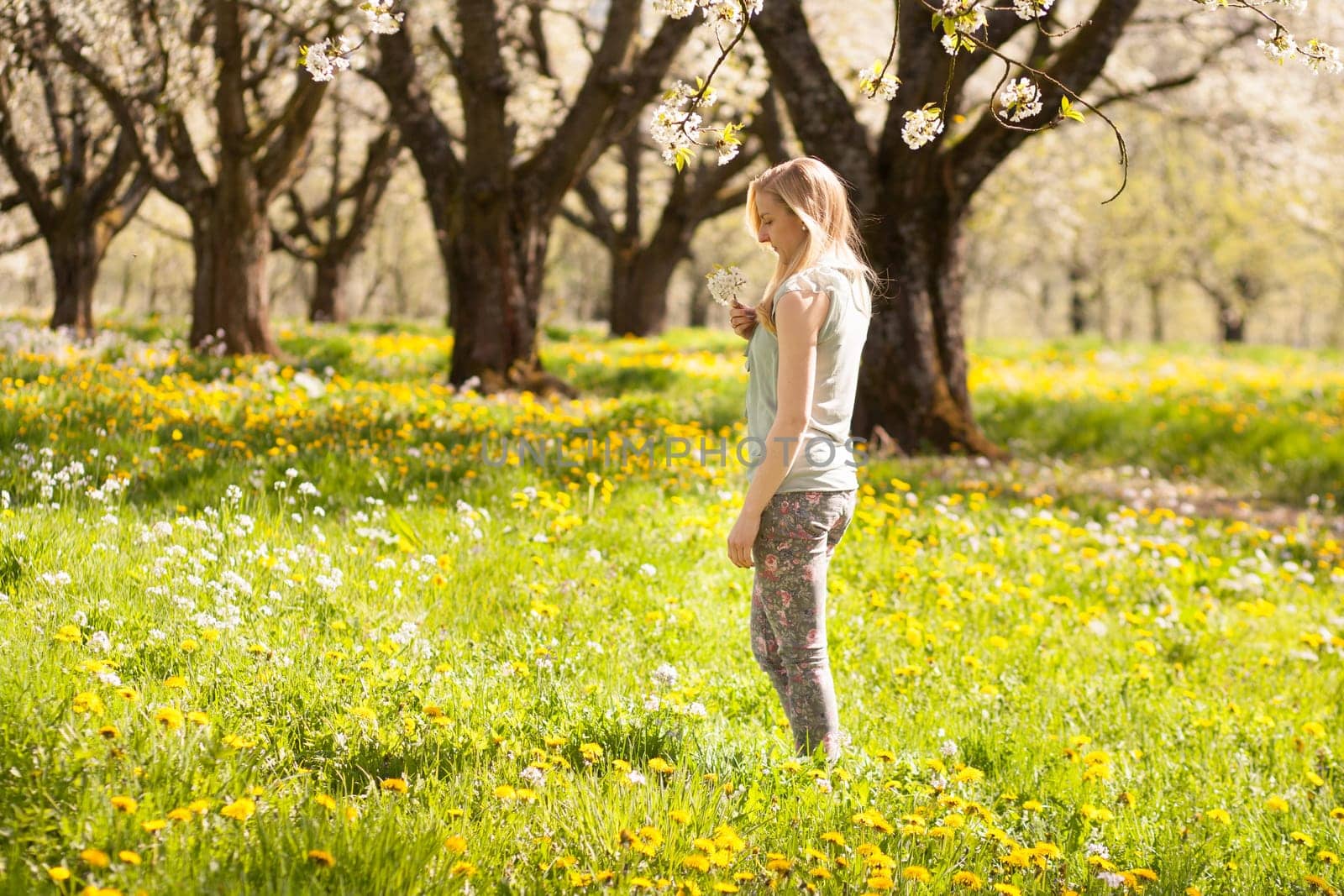 Young woman on flower meadow