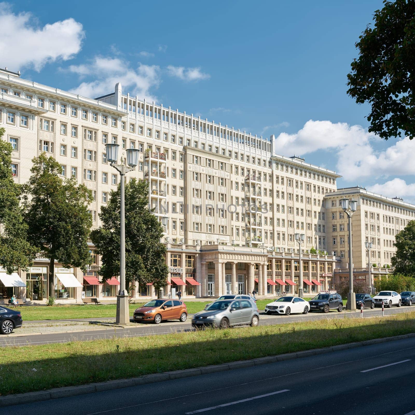 Stores and apartments in Karl-Marx-Allee in the center of Berlin. Karl-Marx-Allee was the boulevard of the former GDR.