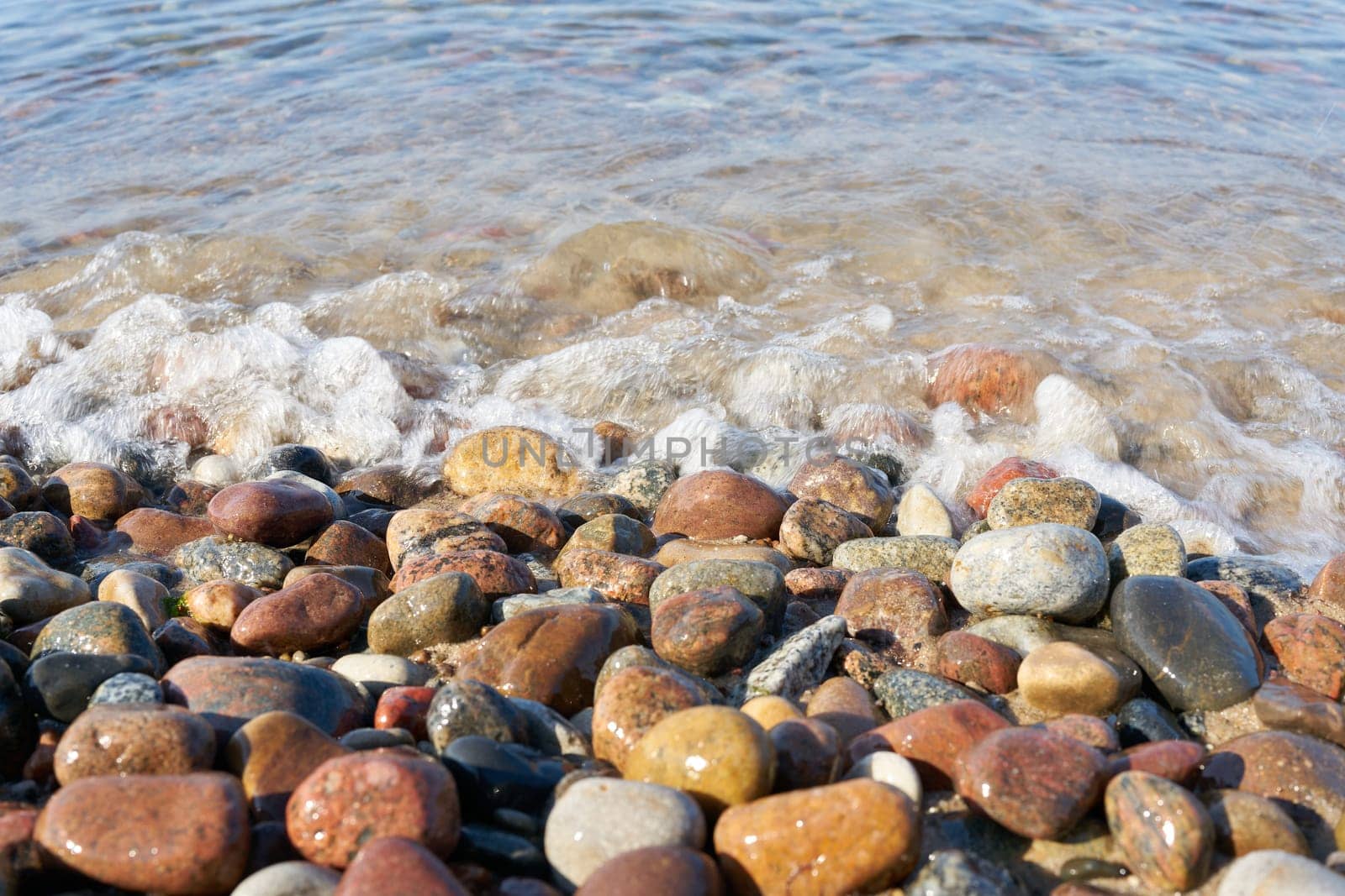 gravel on the beach of the Baltic Sea near Kolobrzeg in Poland in summer